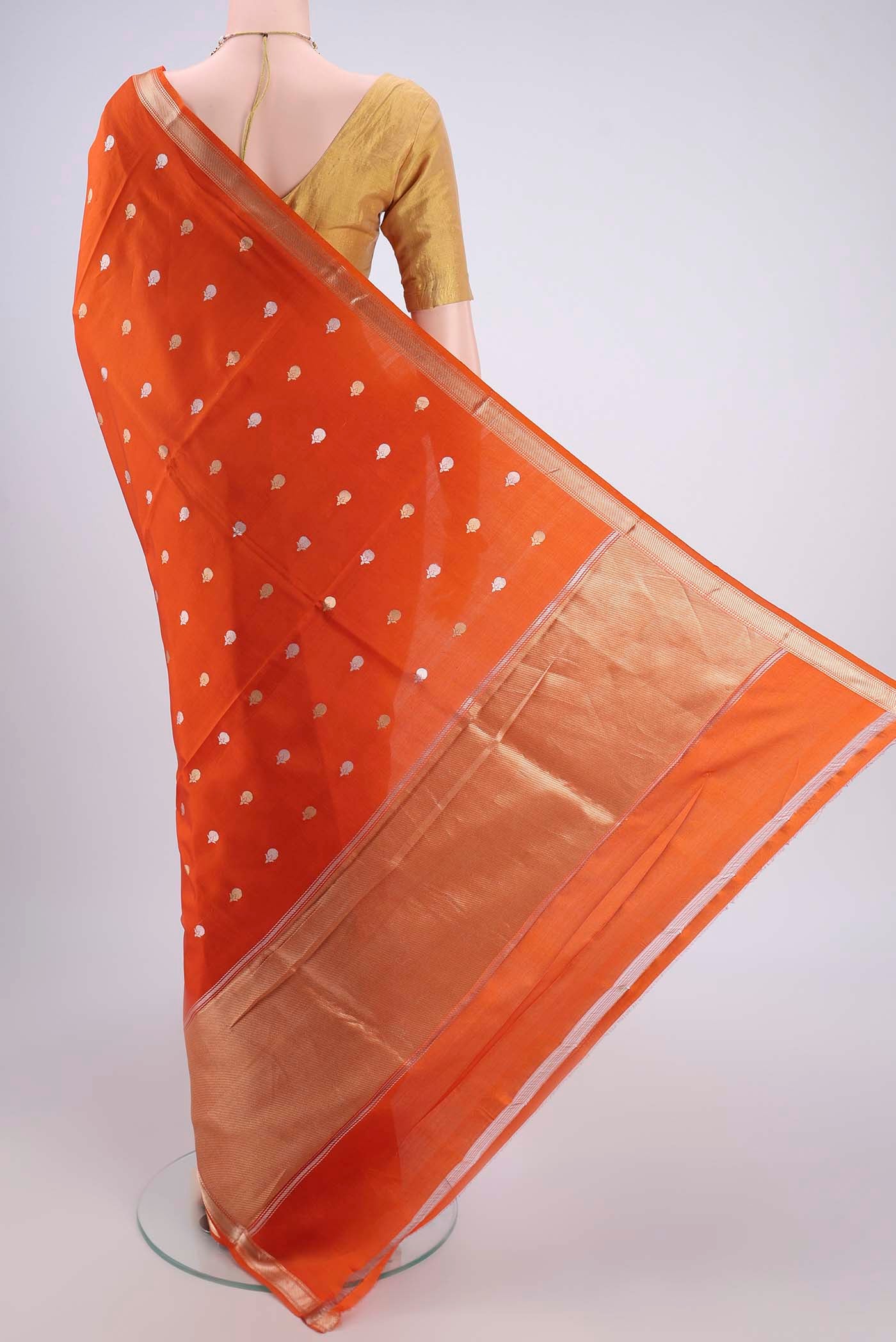 Flat view of Rust Banarasi Katan Silk Saree with Zari Butta on the body and Zari Border. 