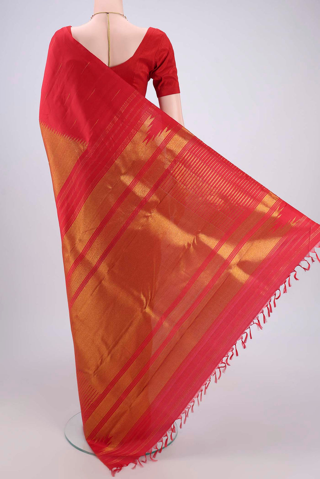 Flat view of Red Dual Tone Kanjivaram Silk Saree with Zari Brocade on the body and Temple Border. 