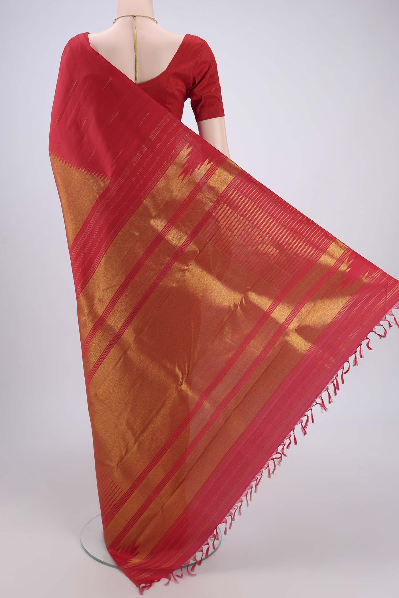 Flat view of Red Dual Tone Kanjivaram Silk Saree with Zari Brocade on the body and Temple Border. 