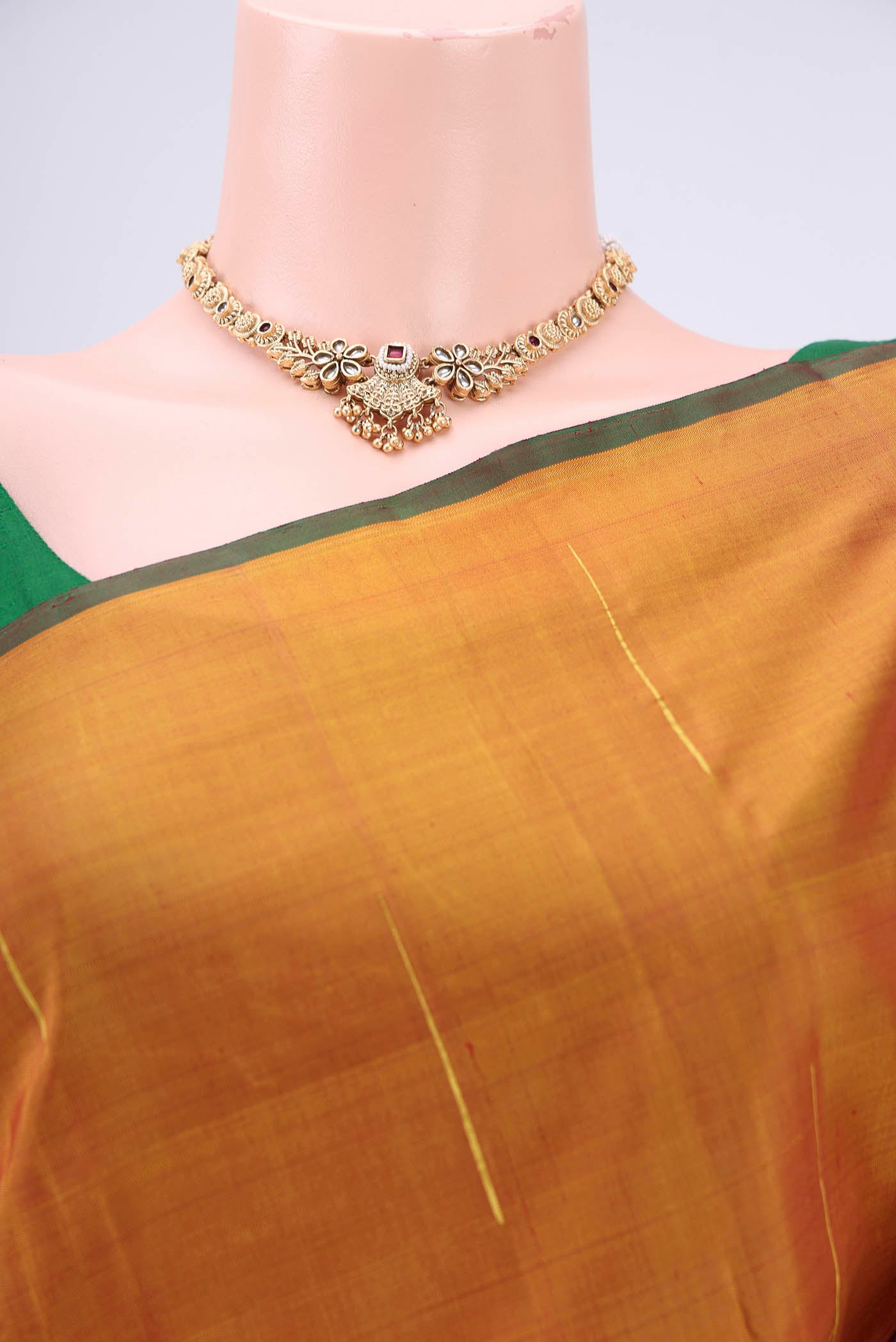 Border image of Maroon Dual Tone Kanjivaram Silk Saree with Zari Butta on the body and Ganga Jamuna Border. 