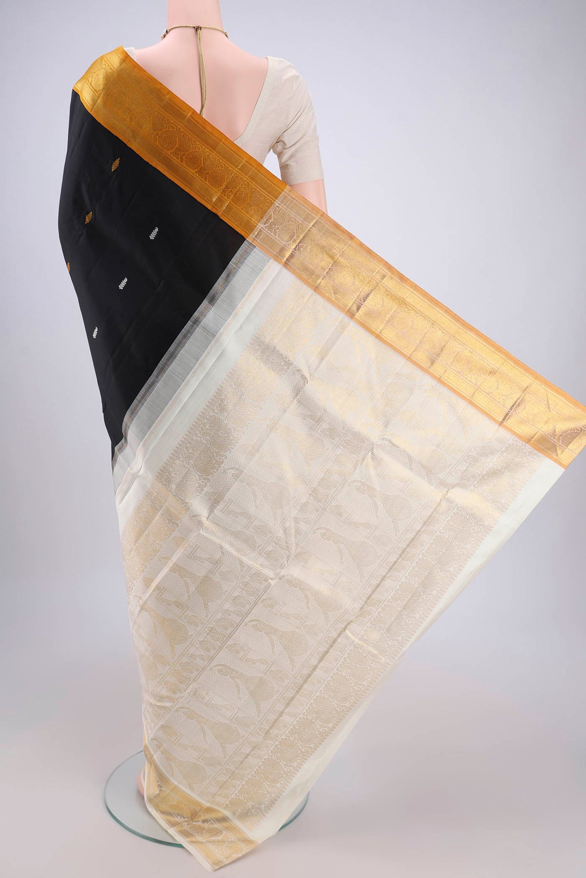 Flat view of Black Dual Tone Kanjivaram Silk Saree with Plain Body and Ganga Jamuna Border. 