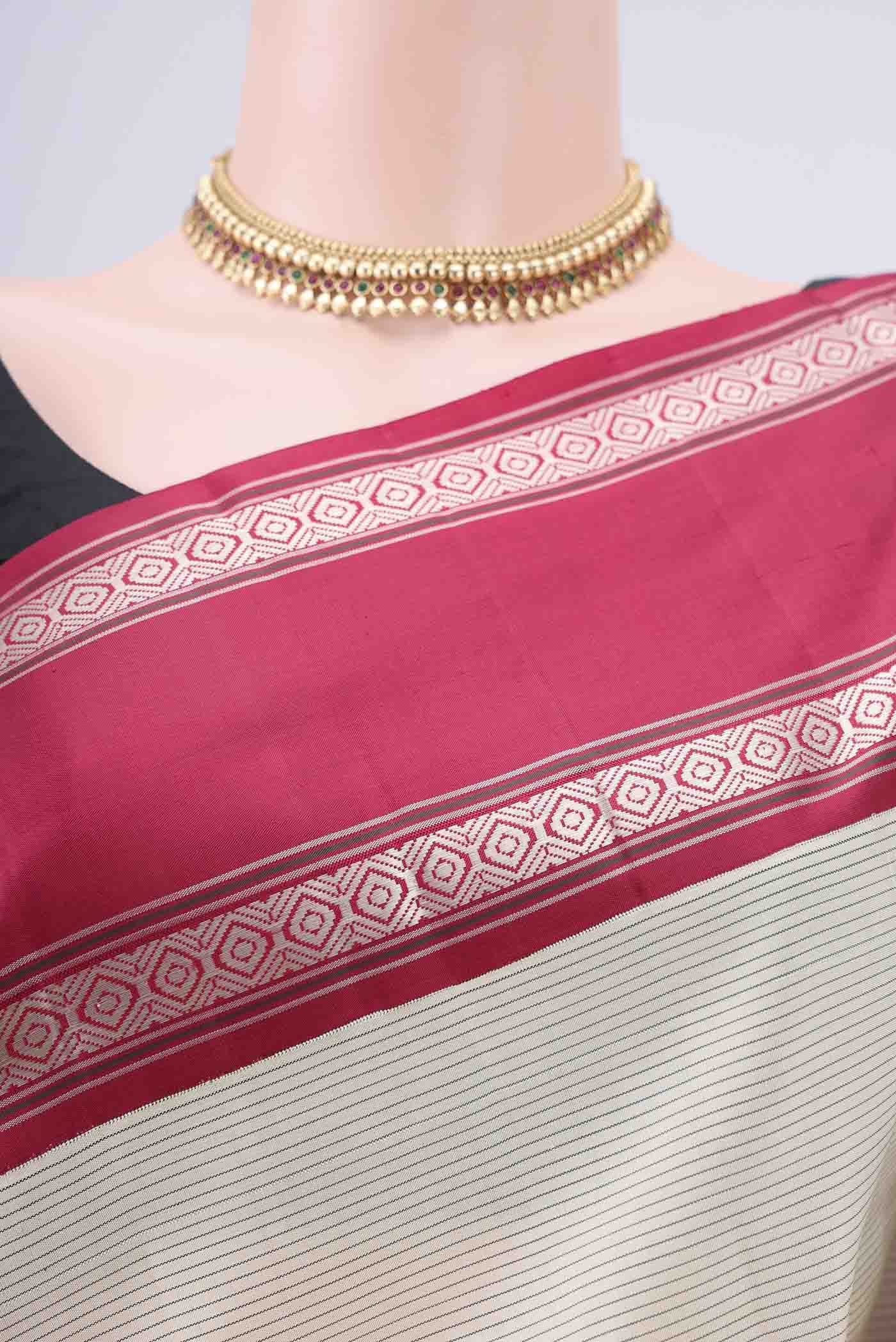 Border image of Off White Kanjivaram Silk Saree with Stripes on the body and Ganga Jamuna Border. 