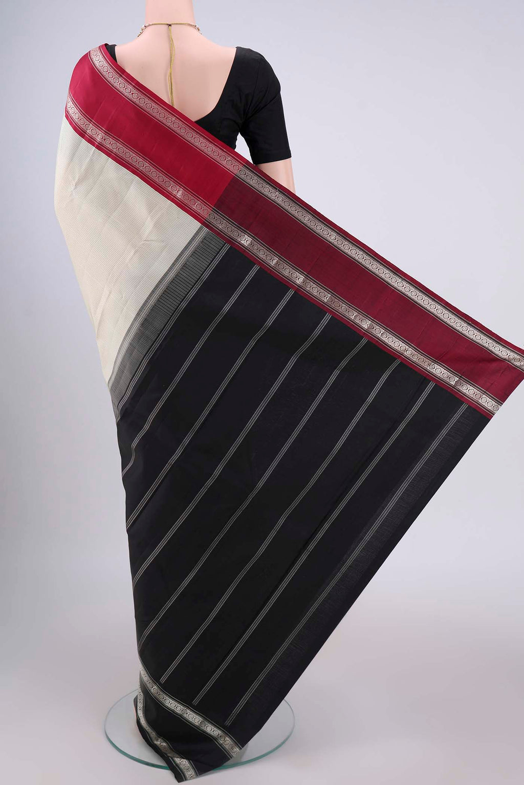 Flat view of Off White Kanjivaram Silk Saree with Stripes on the body and Ganga Jamuna Border. 