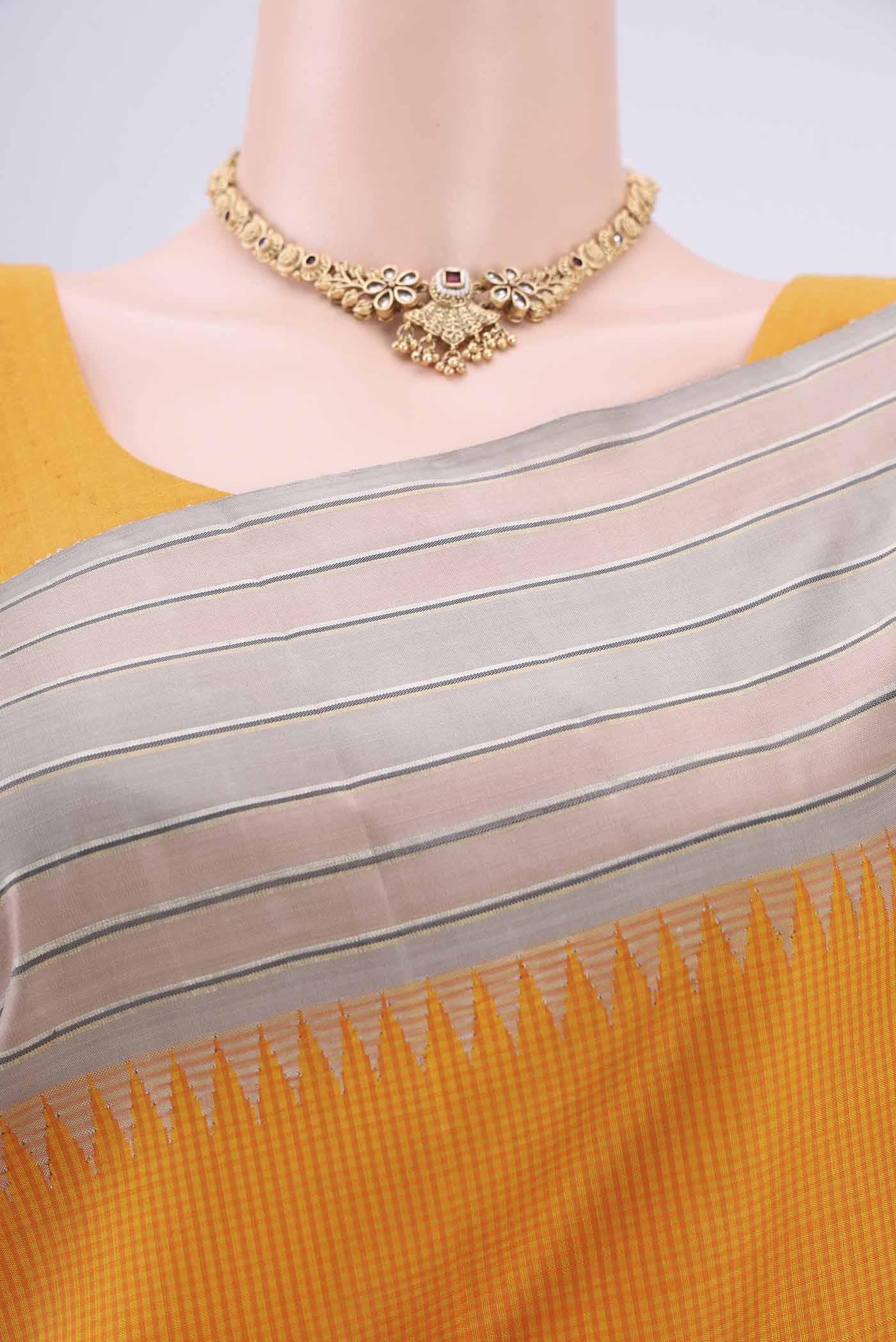 Border image of Yellow Dual Tone Kanjivaram Silk Saree with Checked design on the body and Zari Border. 