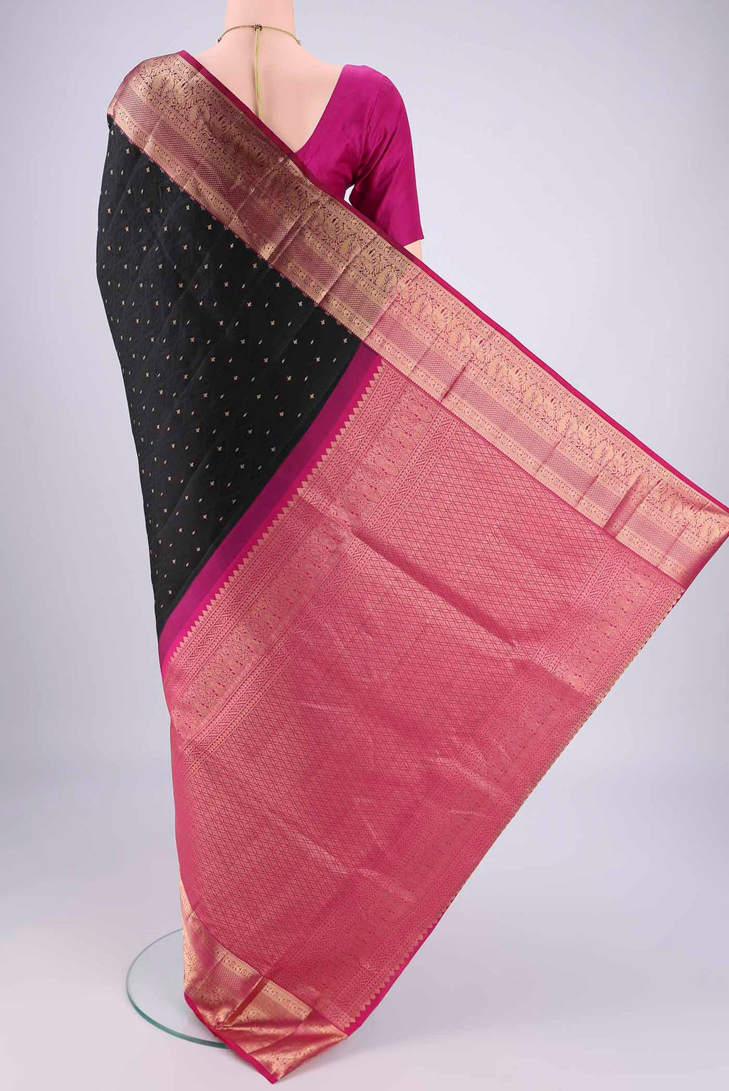 Flat view of Black Dual Tone Soft Silk Saree with Jacquard With Zari Butta on the body and Zari Border. 