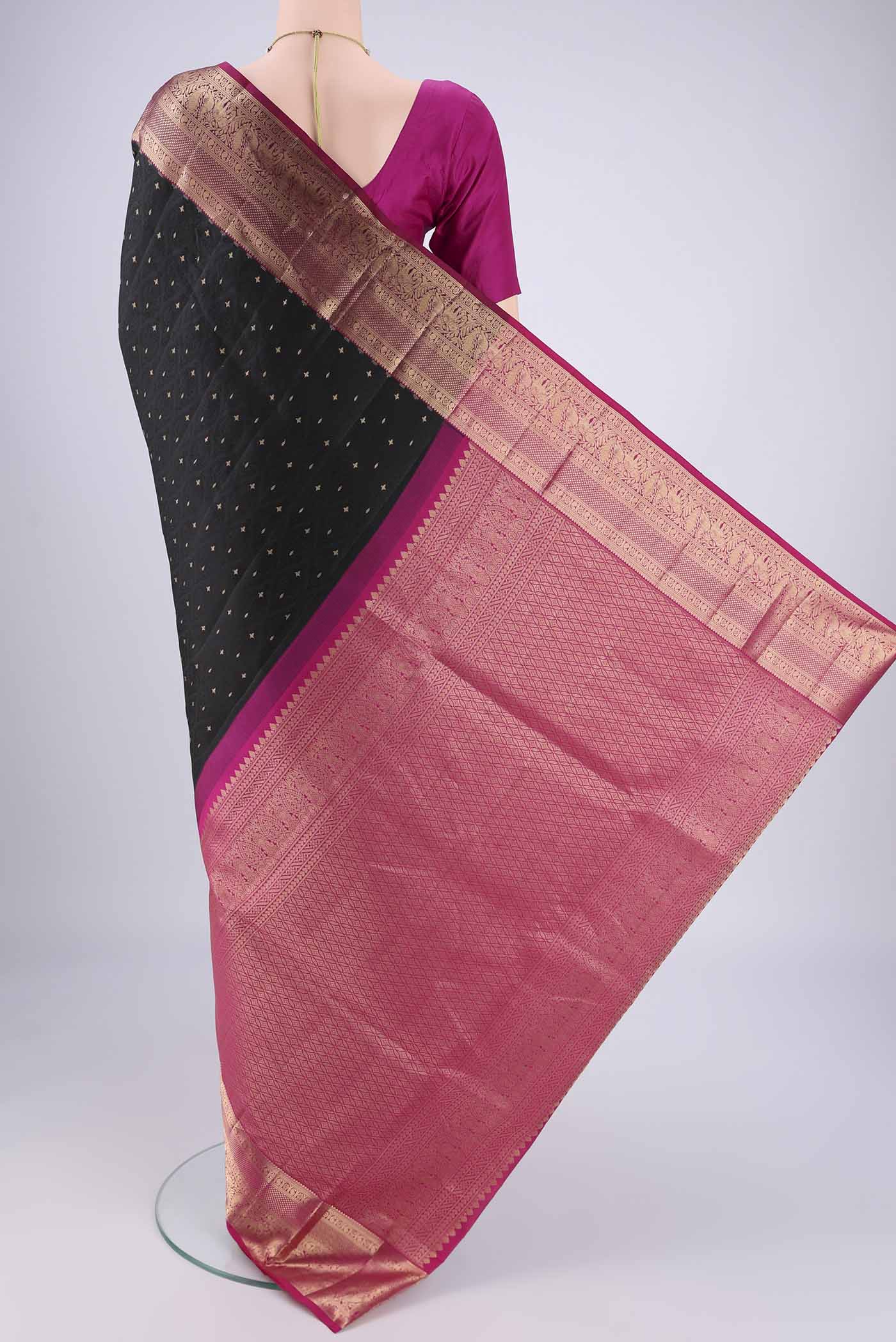 Flat view of Black Dual Tone Soft Silk Saree with Jacquard With Zari Butta on the body and Zari Border. 