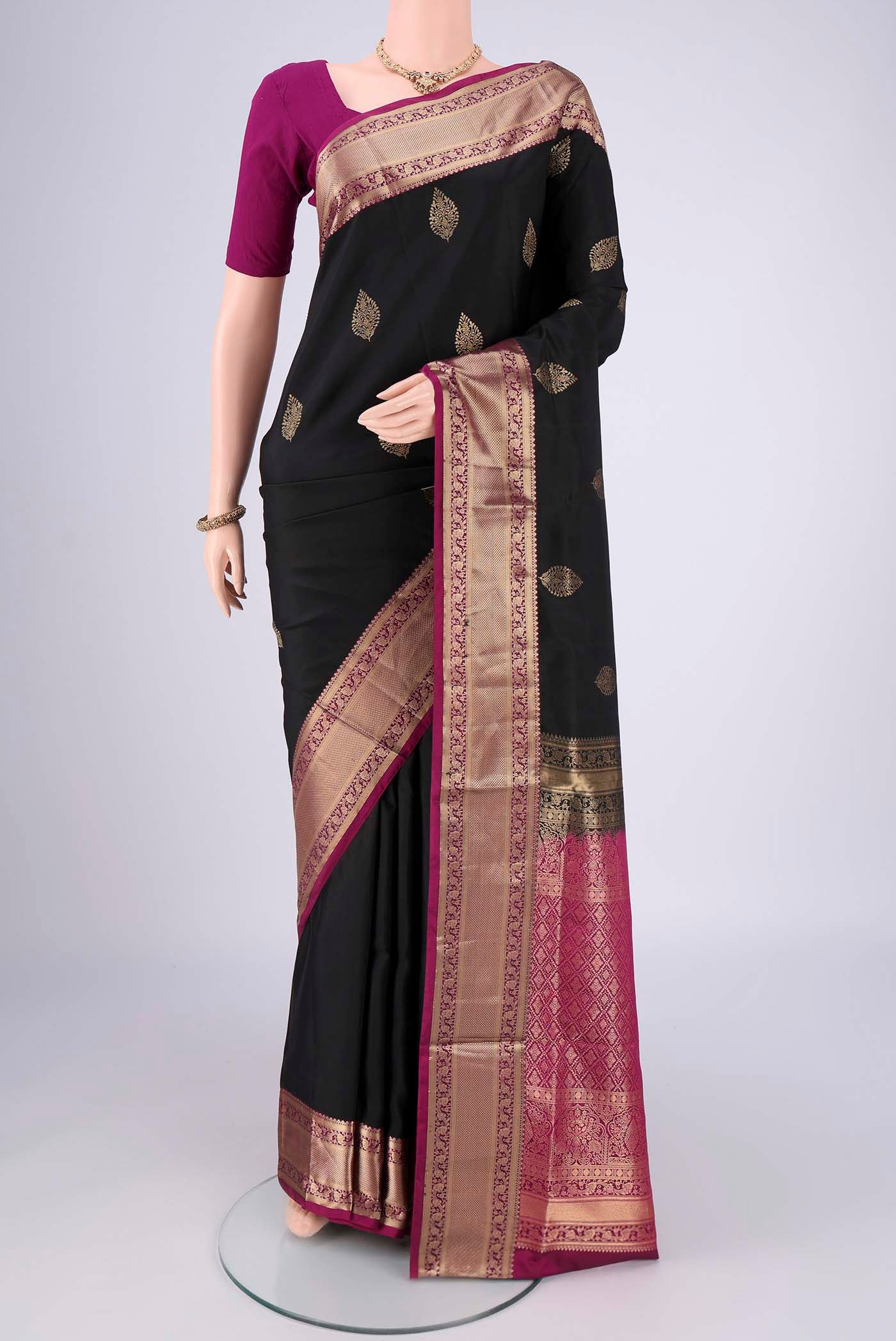 Black Dual Tone Soft Silk Saree with Zari Brocade on the body and Zari Border.  displayed on a mannequin