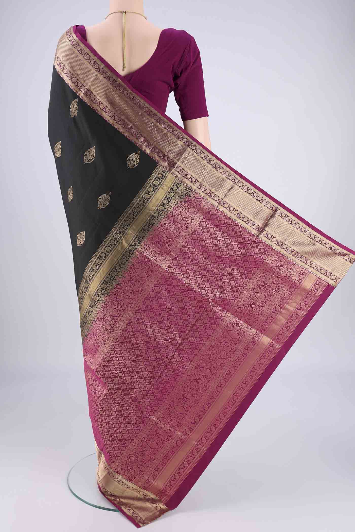 Flat view of Black Dual Tone Soft Silk Saree with Zari Brocade on the body and Zari Border. 