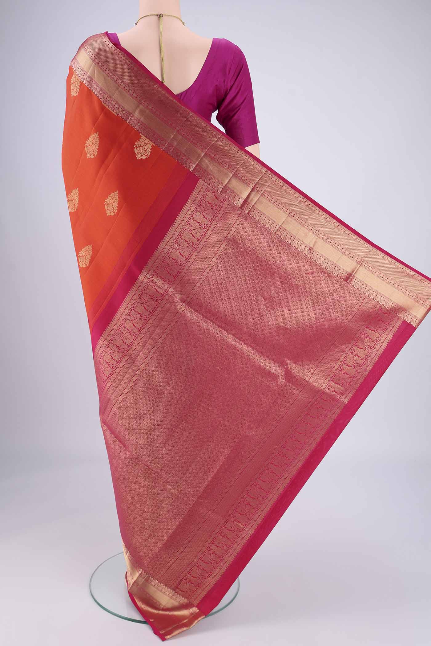 Flat view of Orange Dual Tone Soft Silk Saree with Zari Brocade on the body and Zari Border. 