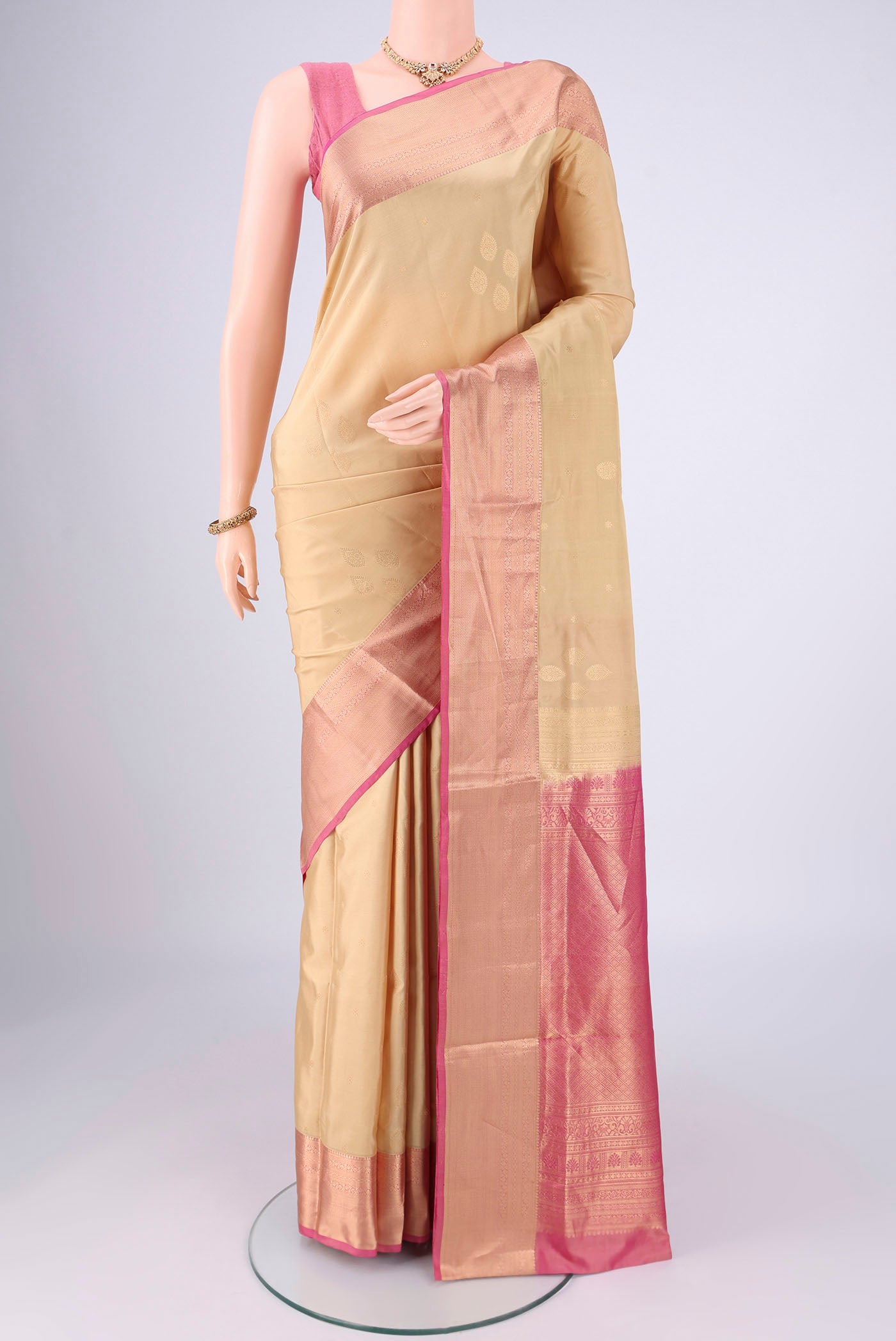 Beige Dual Tone Soft Silk Saree with Zari Brocade on the body and Zari Border.  displayed on a mannequin