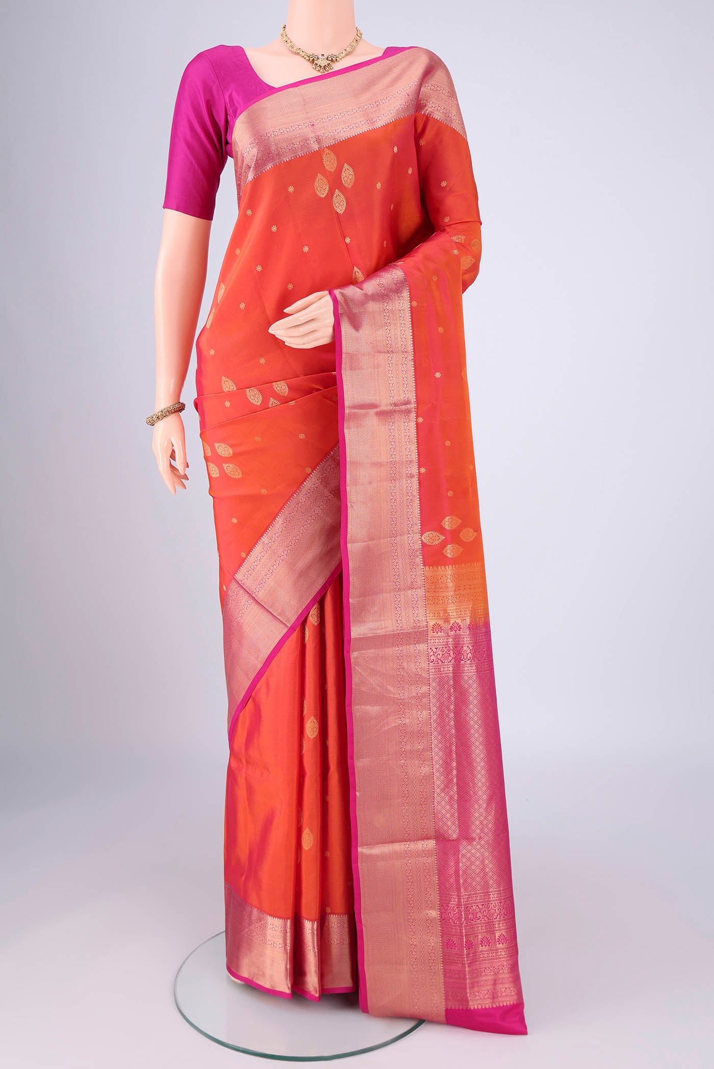 Brick Orange Dual Tone Soft Silk Saree with Zari Brocade on the body and Zari Border.  displayed on a mannequin