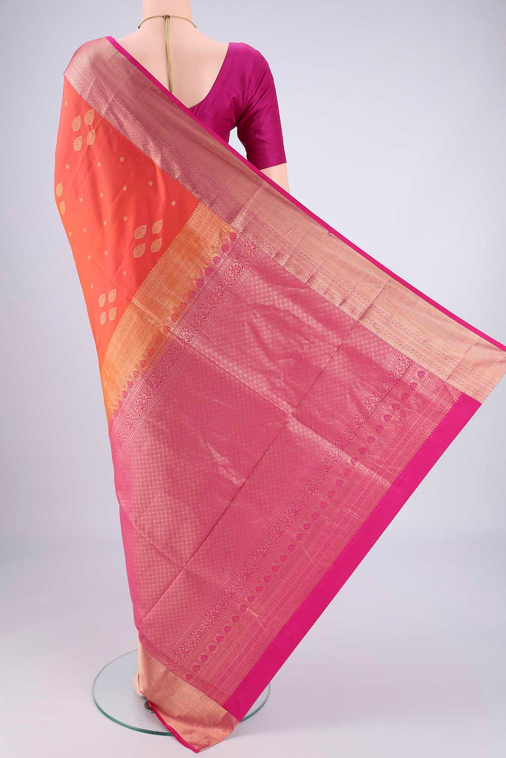 Flat view of Brick Orange Dual Tone Soft Silk Saree with Zari Brocade on the body and Zari Border. 
