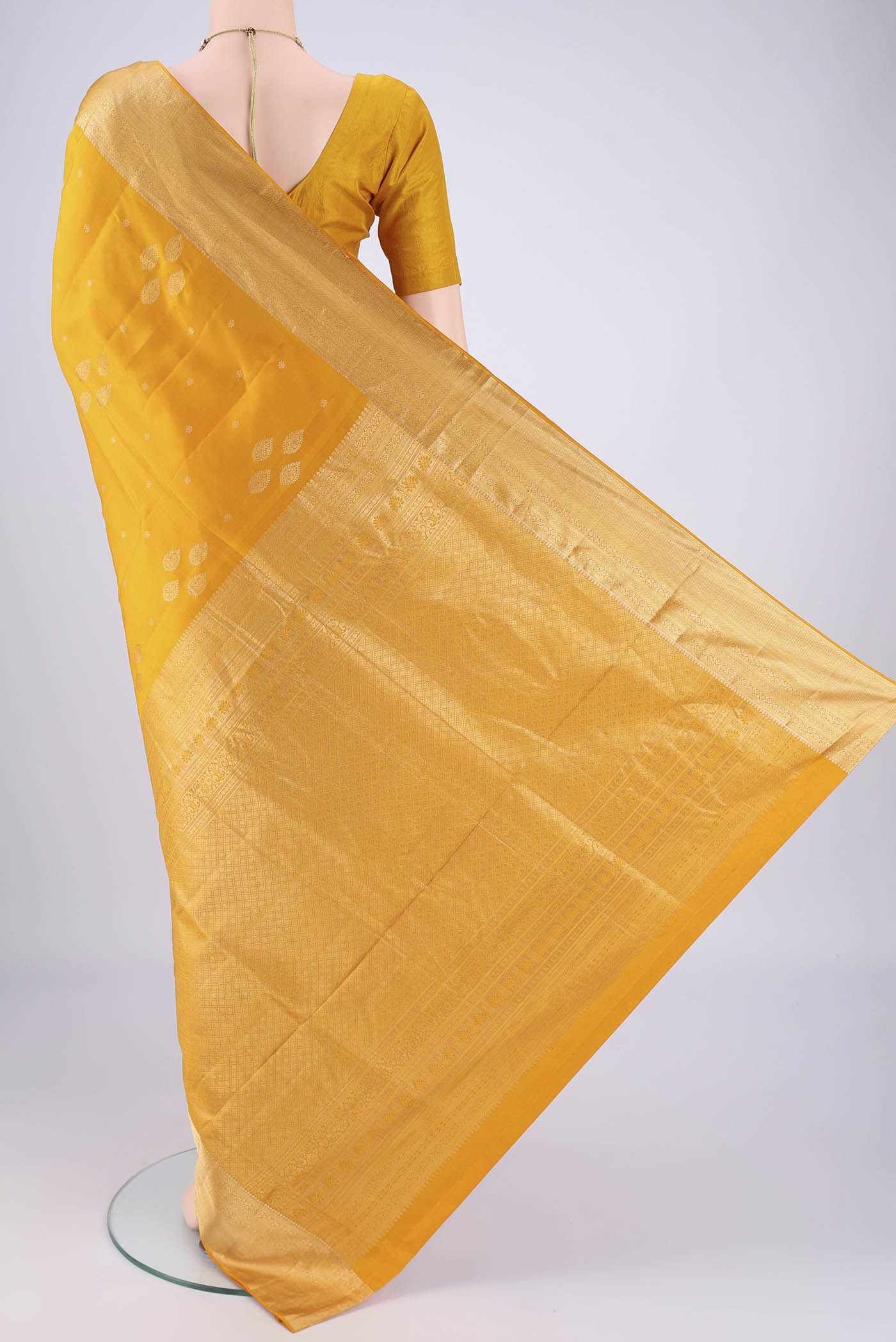 Flat view of Mustard Dual Tone Soft Silk Saree with Zari Brocade on the body and Zari Border. 