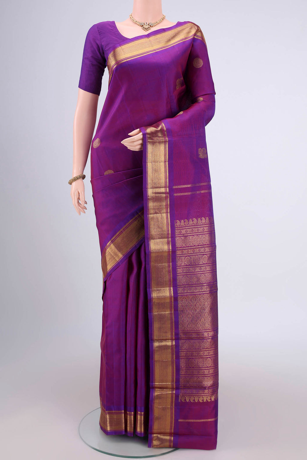 Pure Silk Pure Zari Purple Dual Tone Kanchipuram Saree with Zari Butta on the body and Zari Border.  displayed on a mannequin