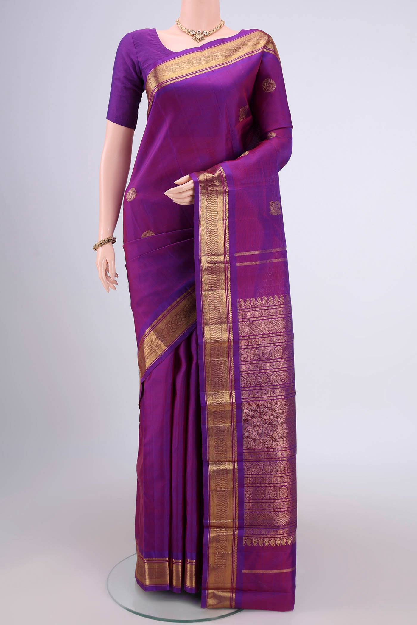 Pure Silk Pure Zari Purple Dual Tone Kanchipuram Saree with Zari Butta on the body and Zari Border.  displayed on a mannequin