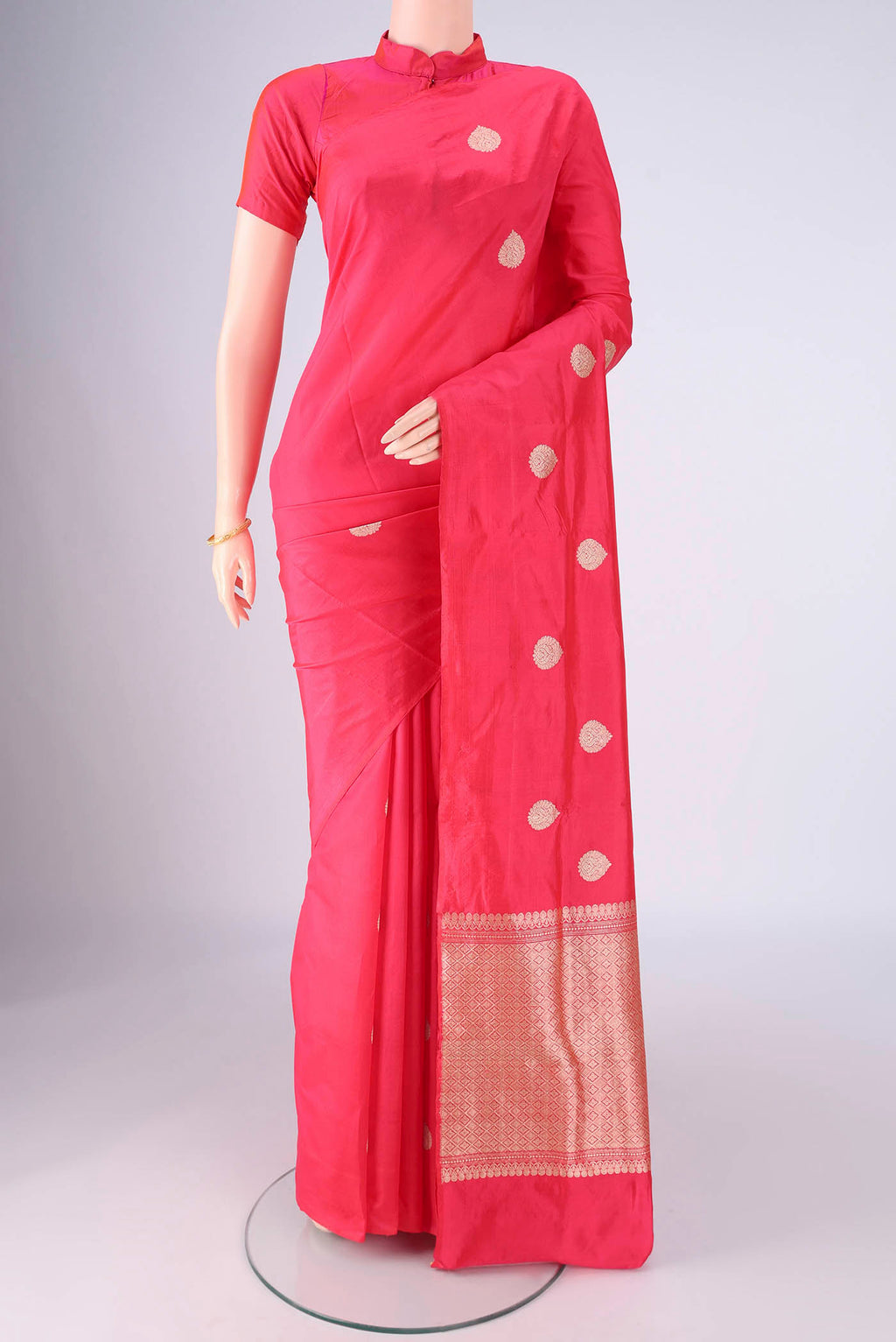 Dark Pink Dual Tone Banarasi Silk Saree with Zari Butta on the body and Without Border.  displayed on a mannequin