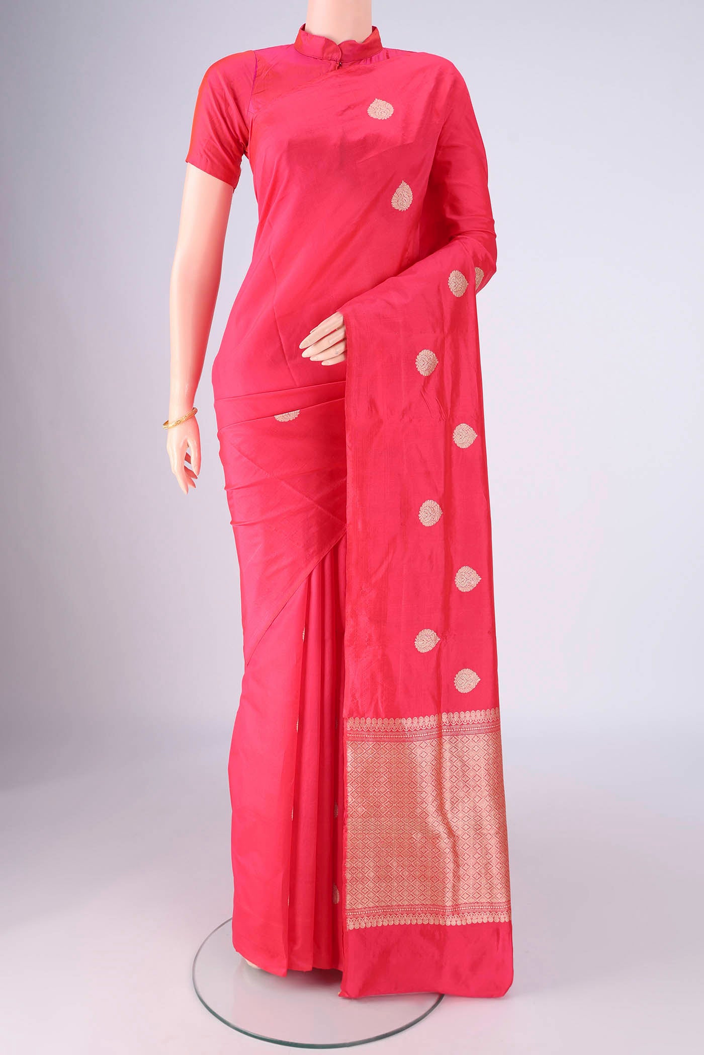 Dark Pink Dual Tone Banarasi Silk Saree with Zari Butta on the body and Without Border.  displayed on a mannequin