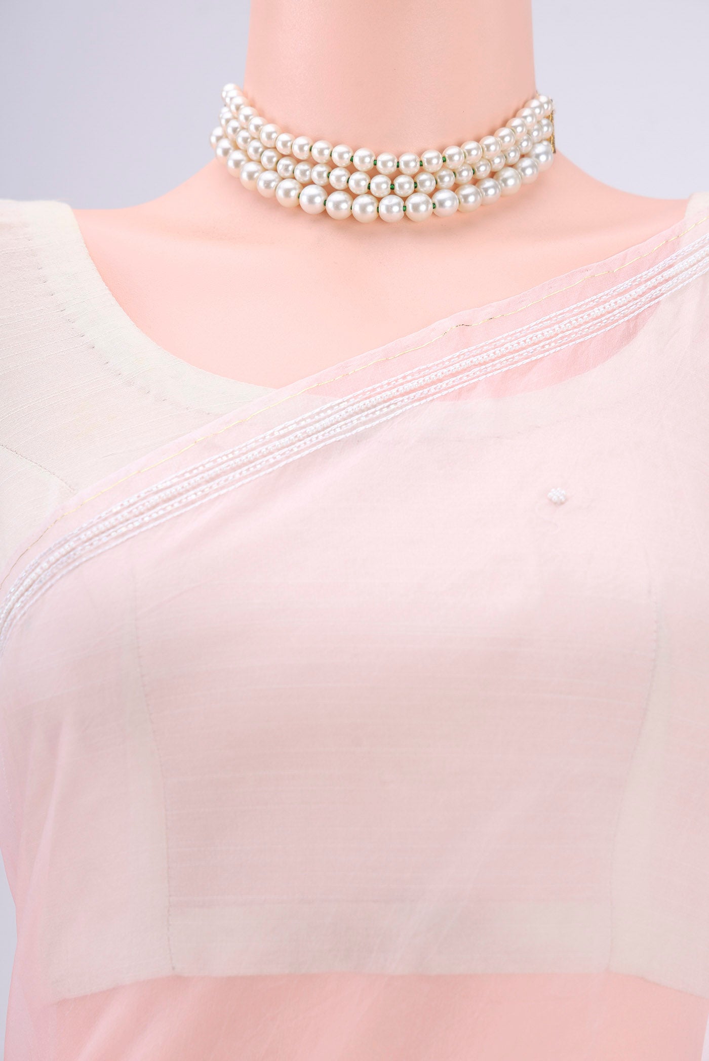 Border image of Rose pink Organza Silk Saree with Embroidery on the body and Thin Zari Line. 