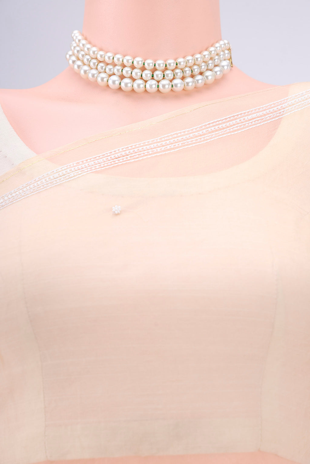 Border image of Beige Organza Silk Saree with Embroidery on the body and Thin Zari Line. 