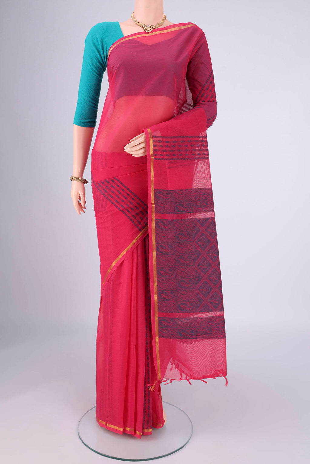 Rani Pink Kanchi Cotton Saree with Stripes on the body and Thin Zari Line.  displayed on a mannequin