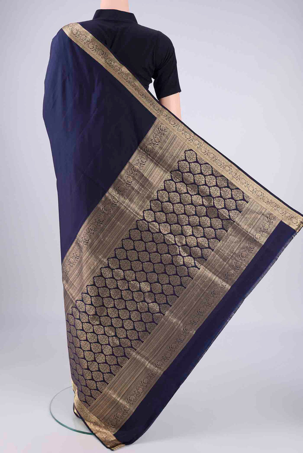 Flat view of Navy Blue Soft Silk Saree with Plain Body and Zari Border. 