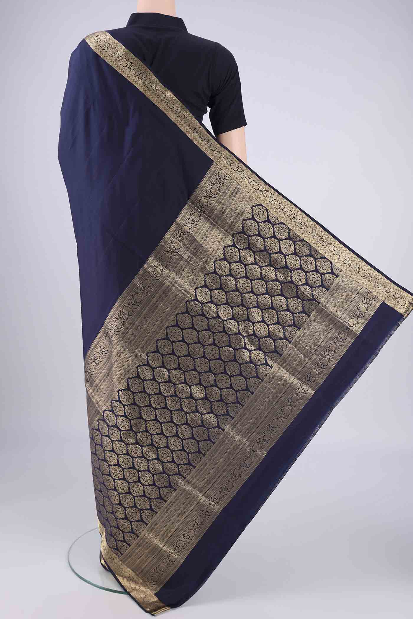 Flat view of Navy Blue Soft Silk Saree with Plain Body and Zari Border. 