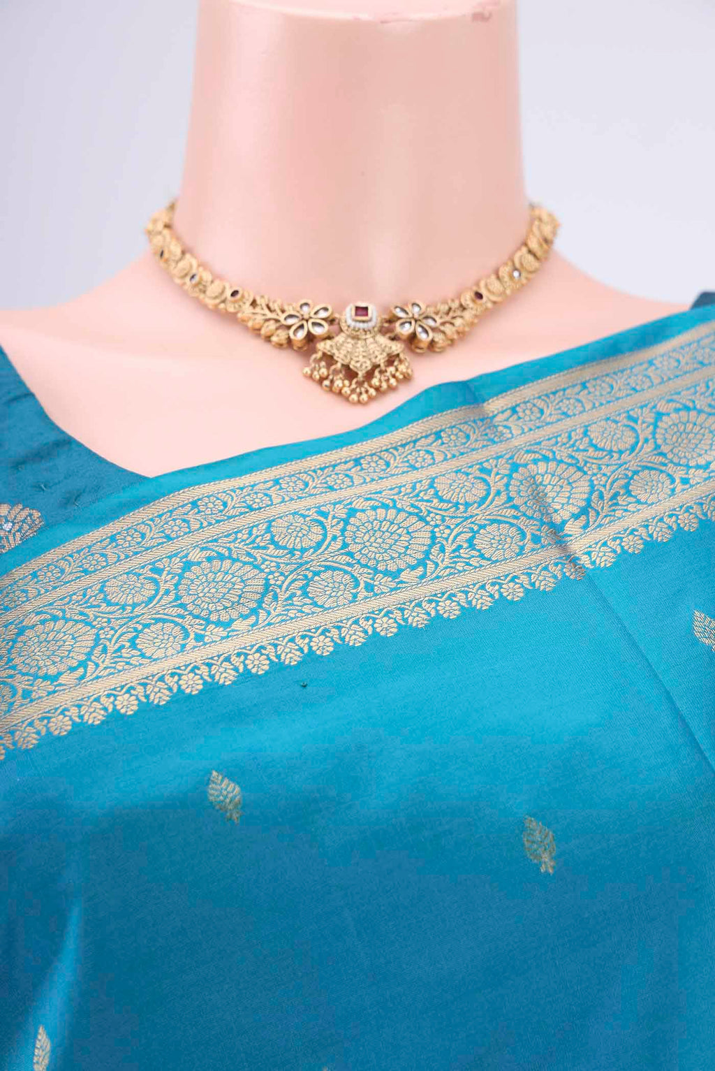 Border image of Turquoise Soft Silk Saree with Zari Butta on the body and Zari Border. 