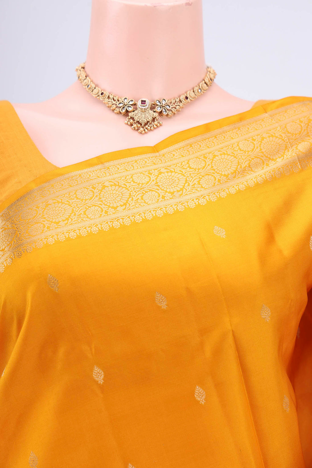 Border image of Yellow Soft Silk Saree with Zari Butta on the body and Zari Border. 
