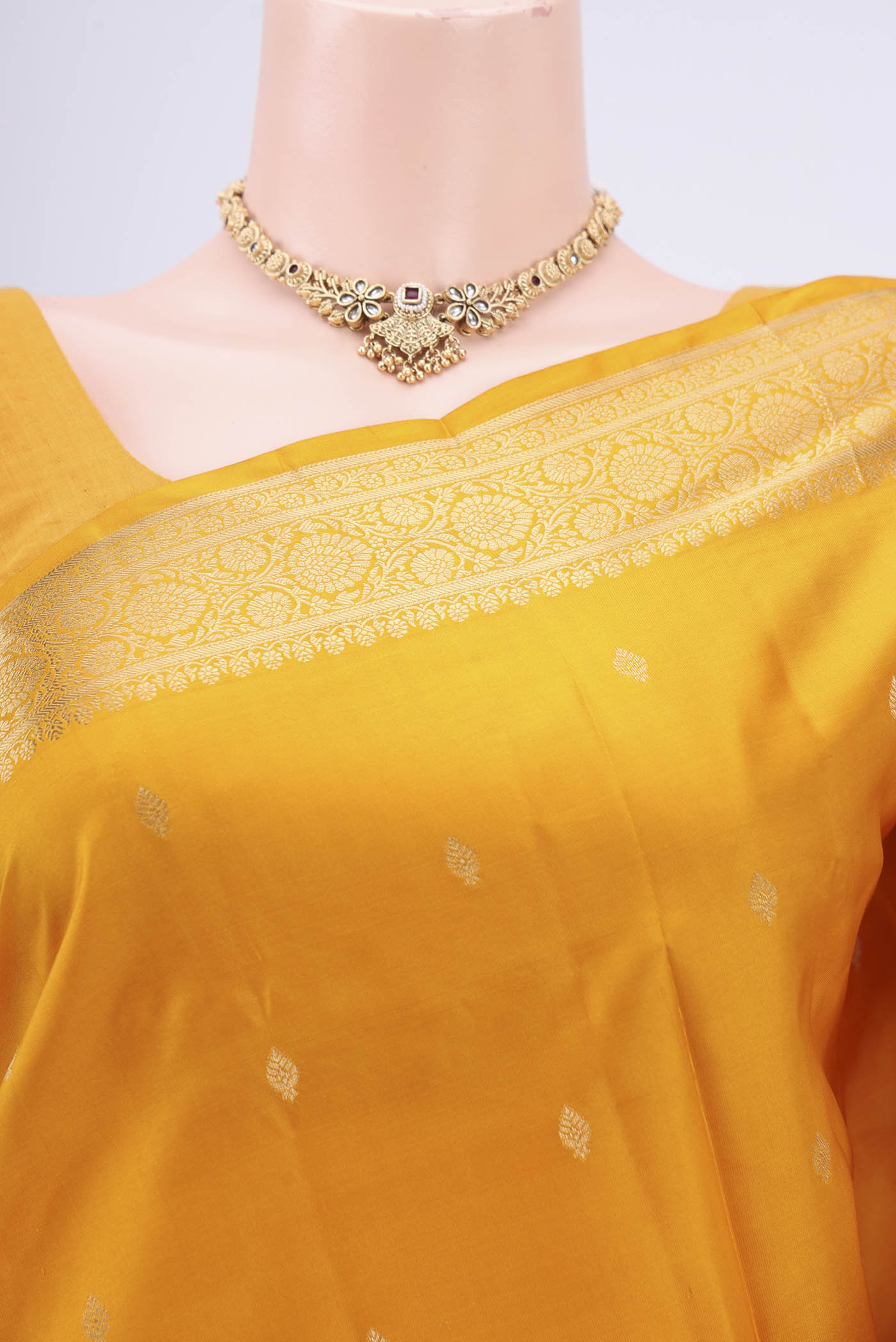 Border image of Yellow Soft Silk Saree with Zari Butta on the body and Zari Border. 