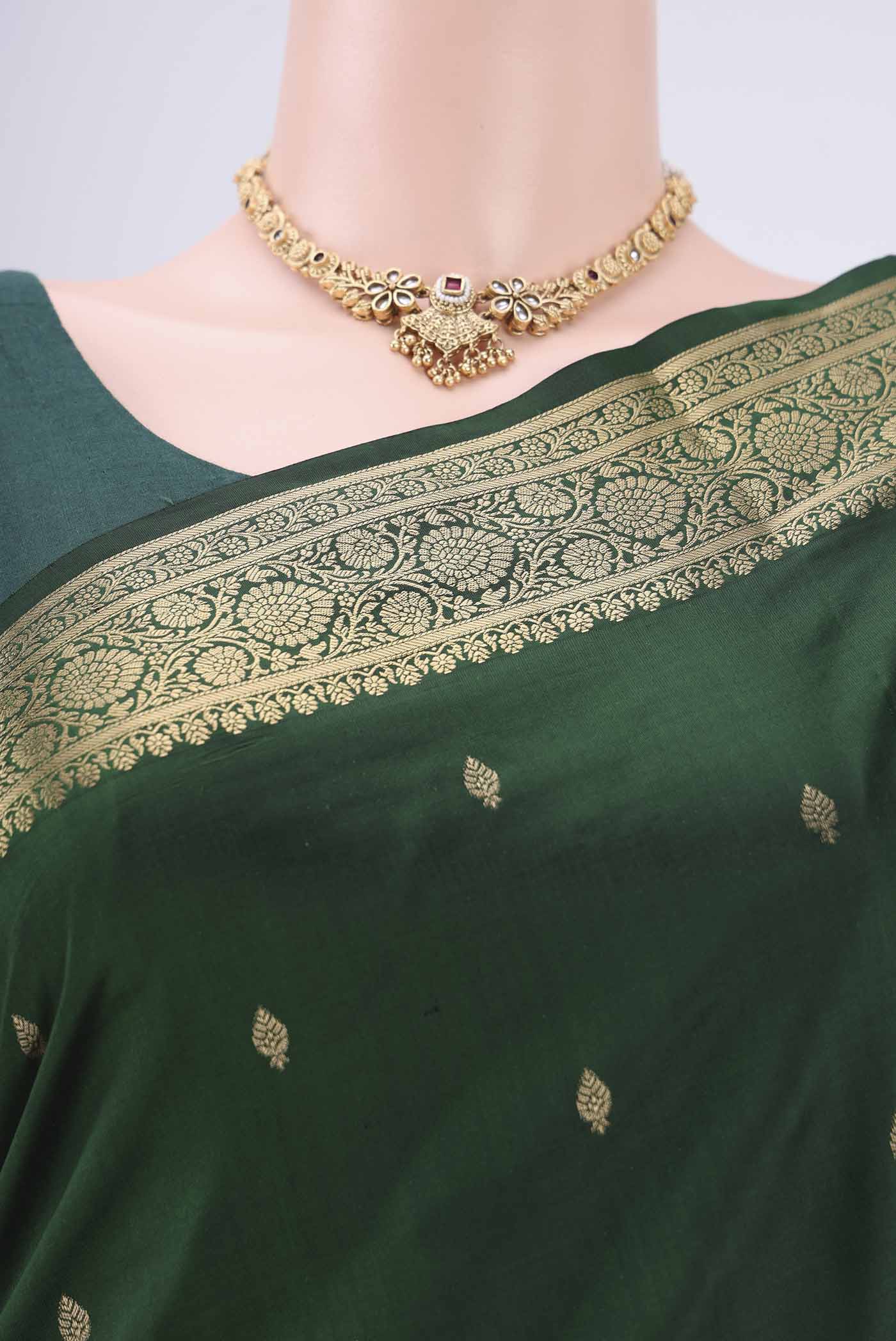 Border image of Bottle Green Soft Silk Saree with Zari Butta on the body and Zari Border. 