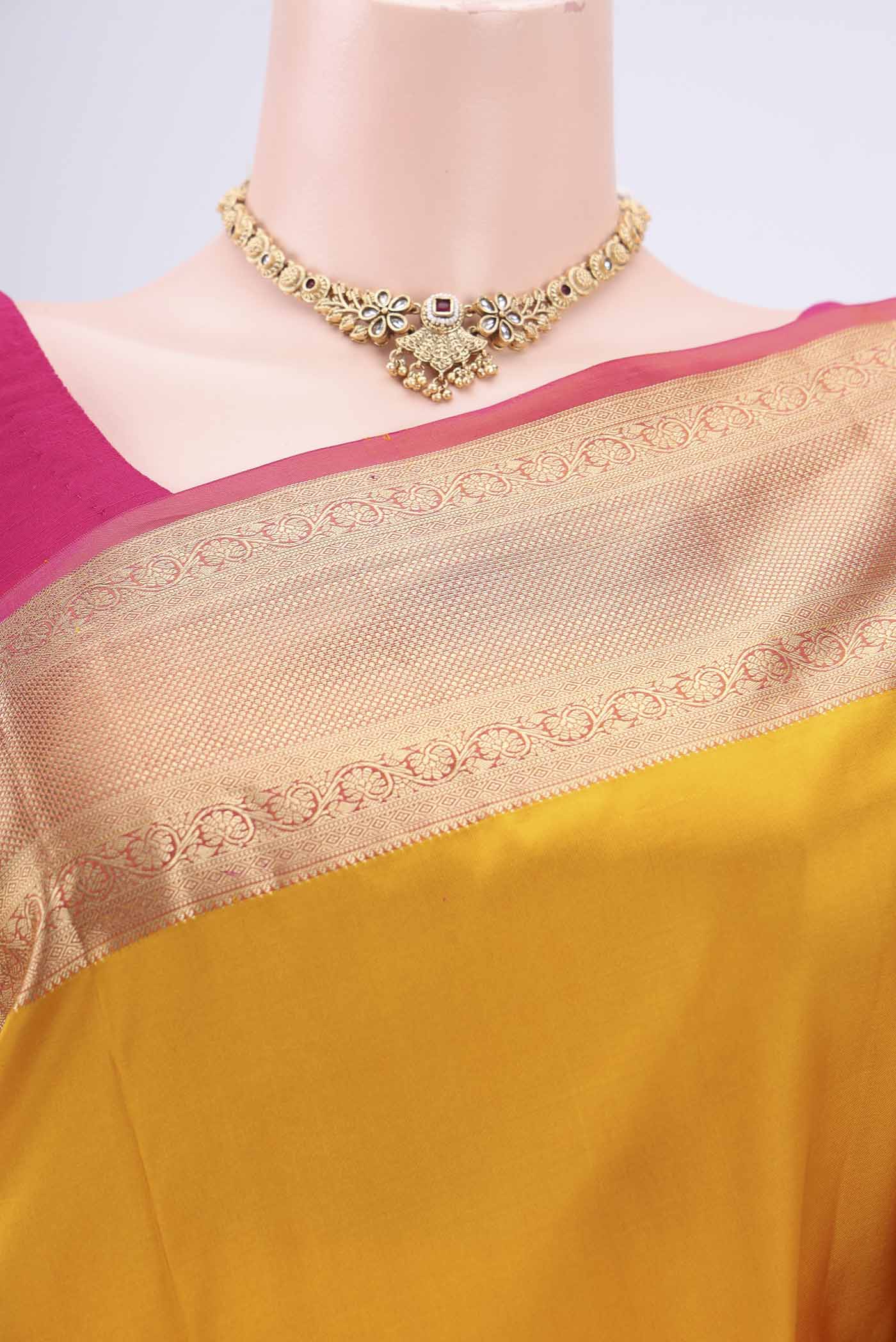 Border image of Yellow Soft Silk Saree with Zari Butta on the body and Zari Border. 