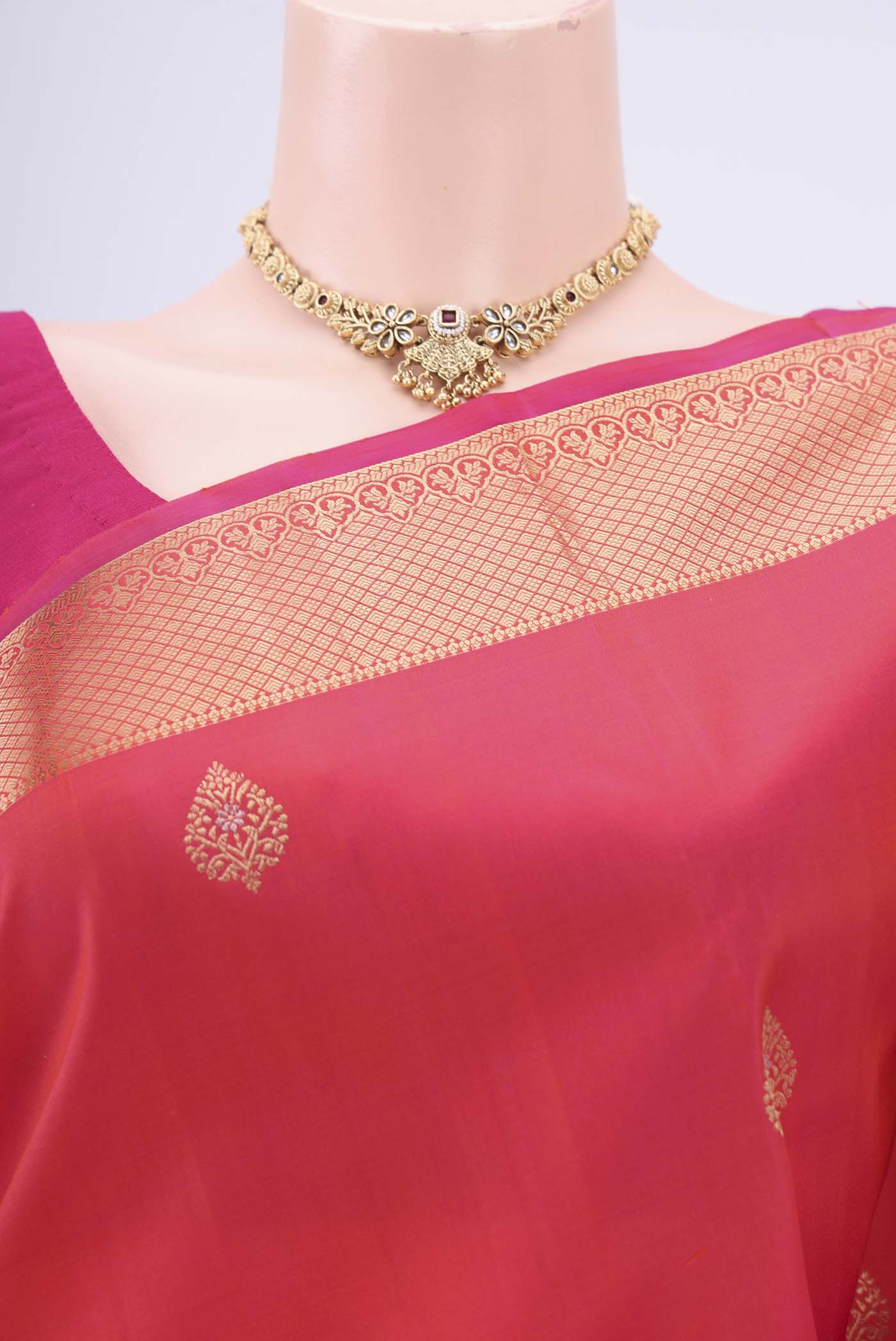 Border image of Orange Soft Silk Saree with Zari Butta on the body and Zari Border. 