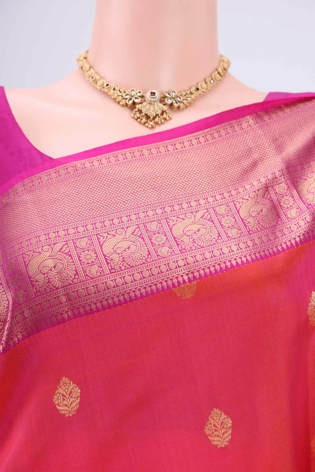 Border image of Orange Soft Silk Saree with Zari Butta on the body and Zari Border. 