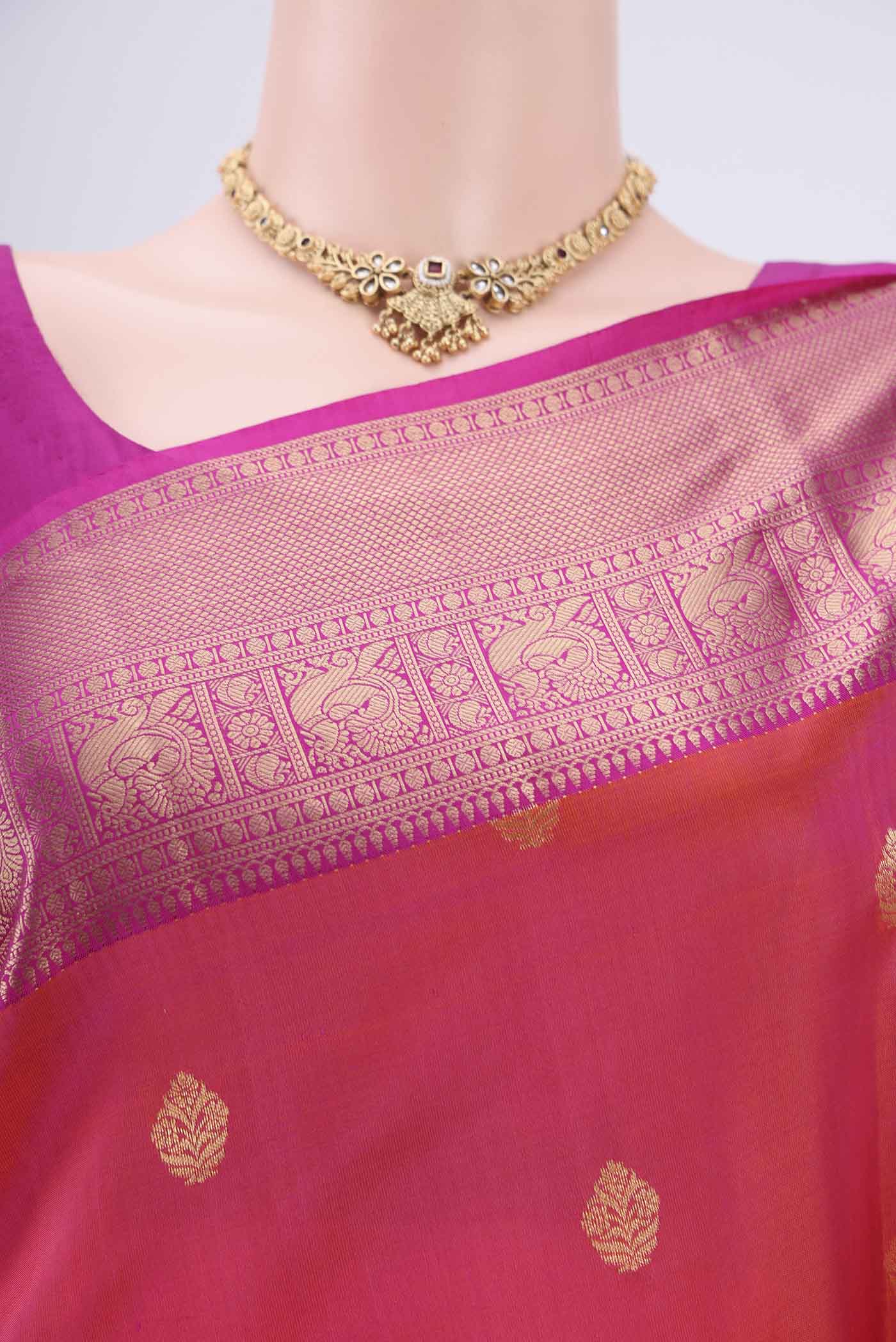 Border image of Orange Soft Silk Saree with Zari Butta on the body and Zari Border. 