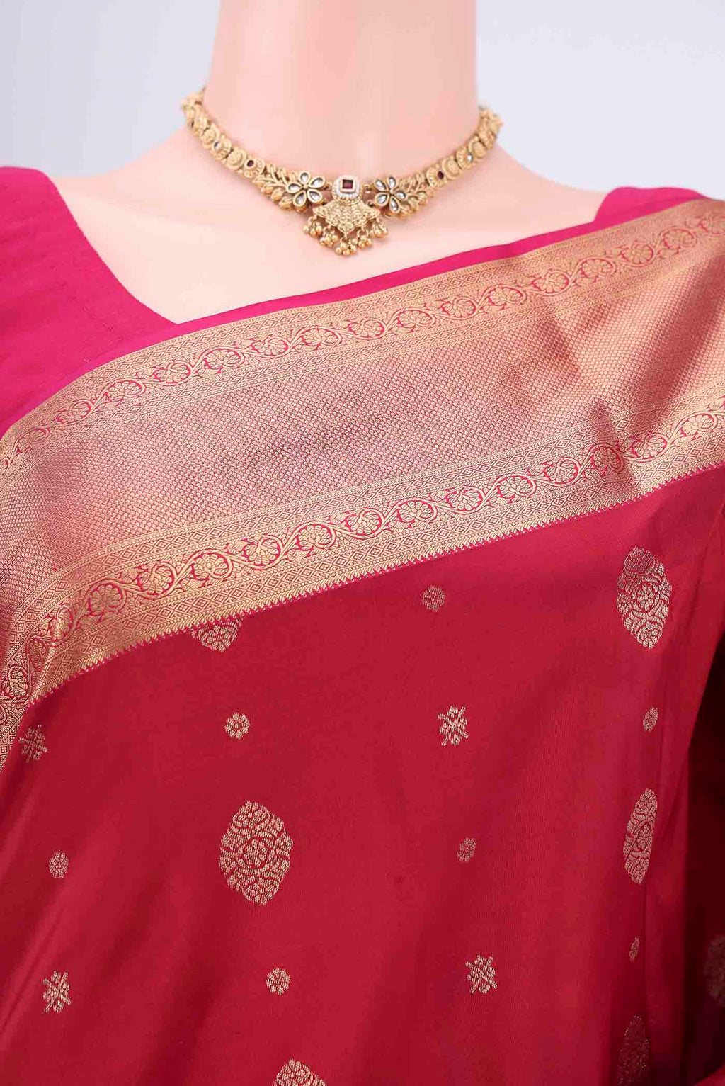 Border image of Maroon Soft Silk Saree with Zari Butta on the body and Zari Border. 