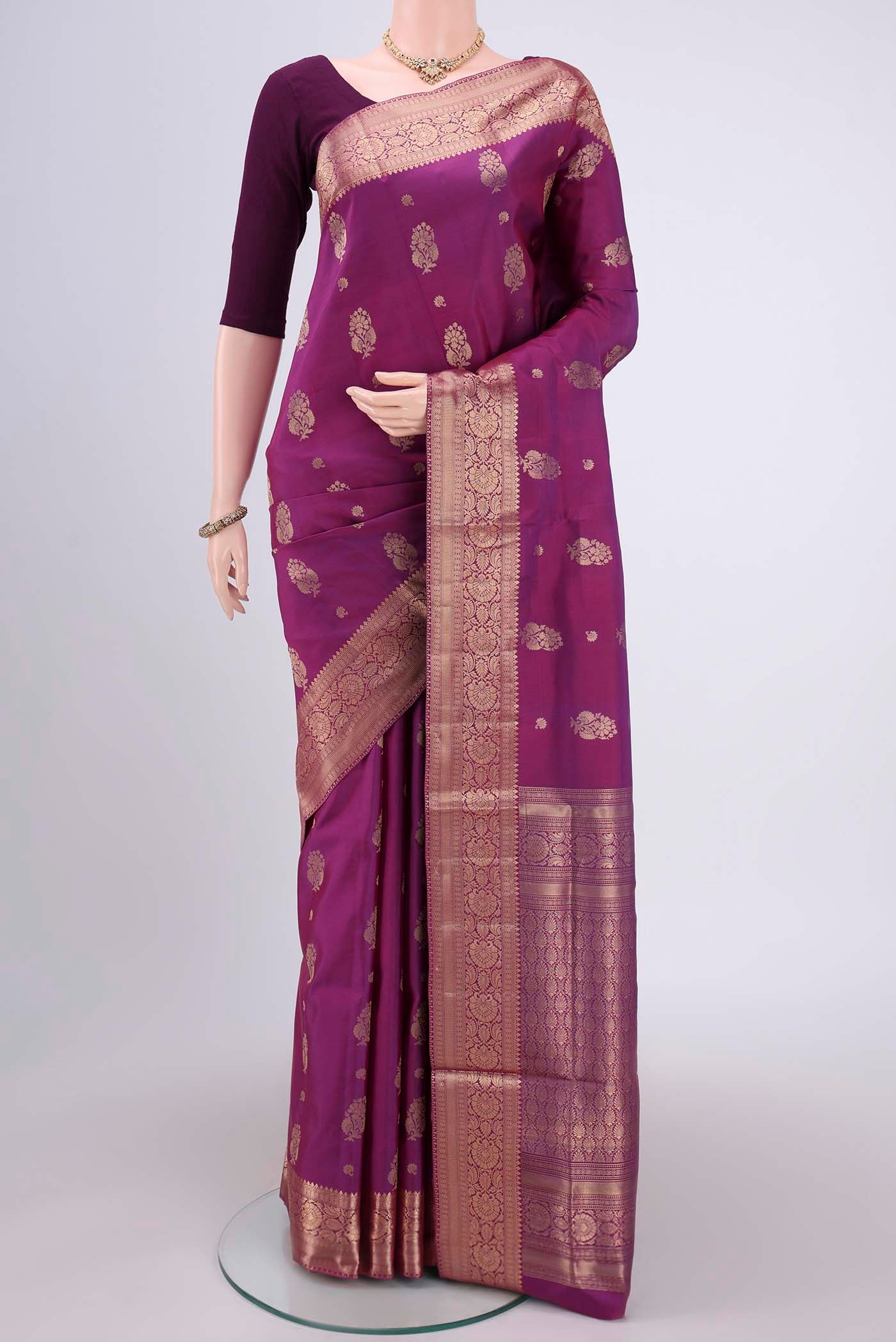 Purple Soft Silk Saree with Zari Butta on the body and Zari Border.  displayed on a mannequin