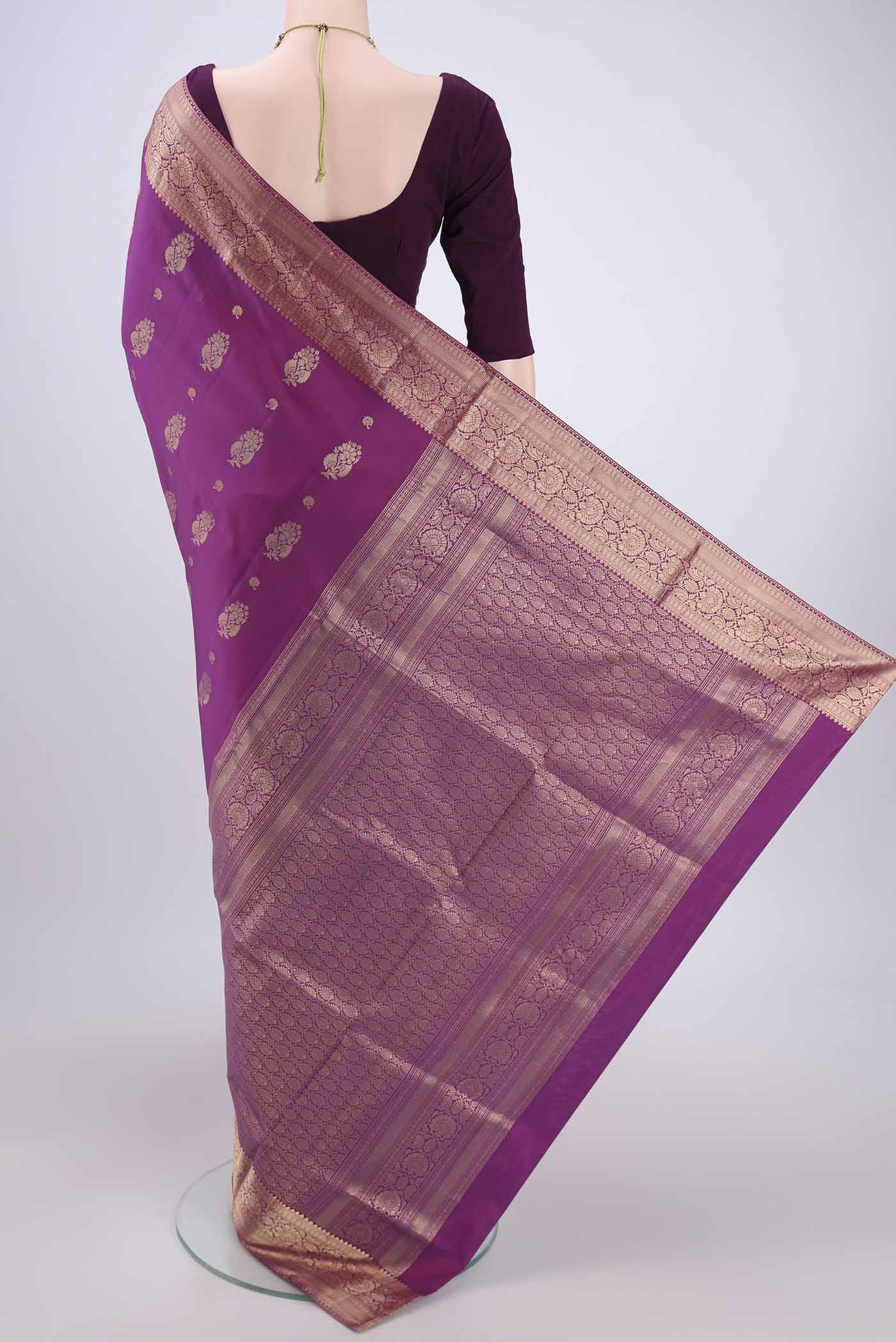 Flat view of Purple Soft Silk Saree with Zari Butta on the body and Zari Border. 