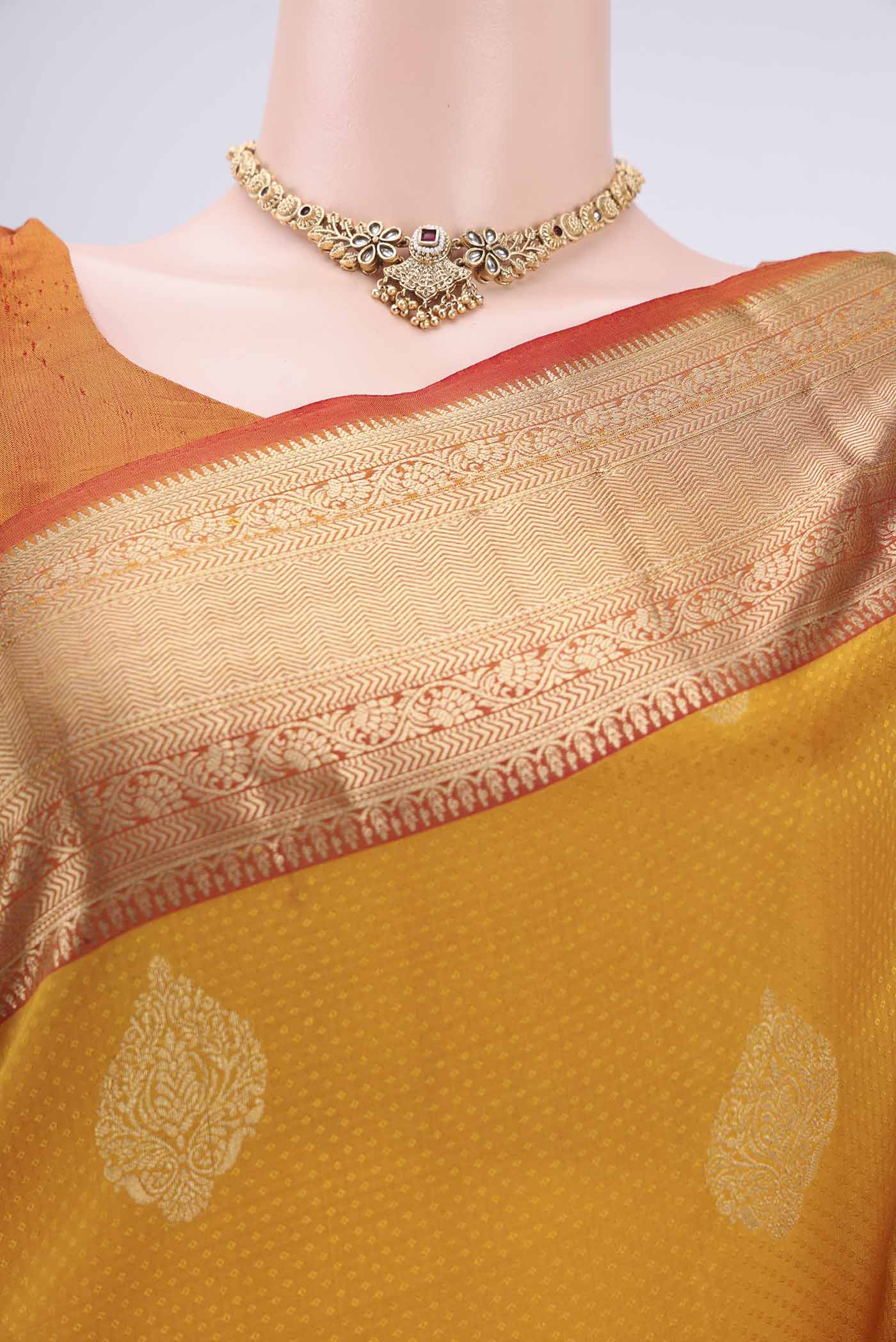 Border image of Yellow Soft Silk Saree with Zari Butta on the body and Zari Border. 
