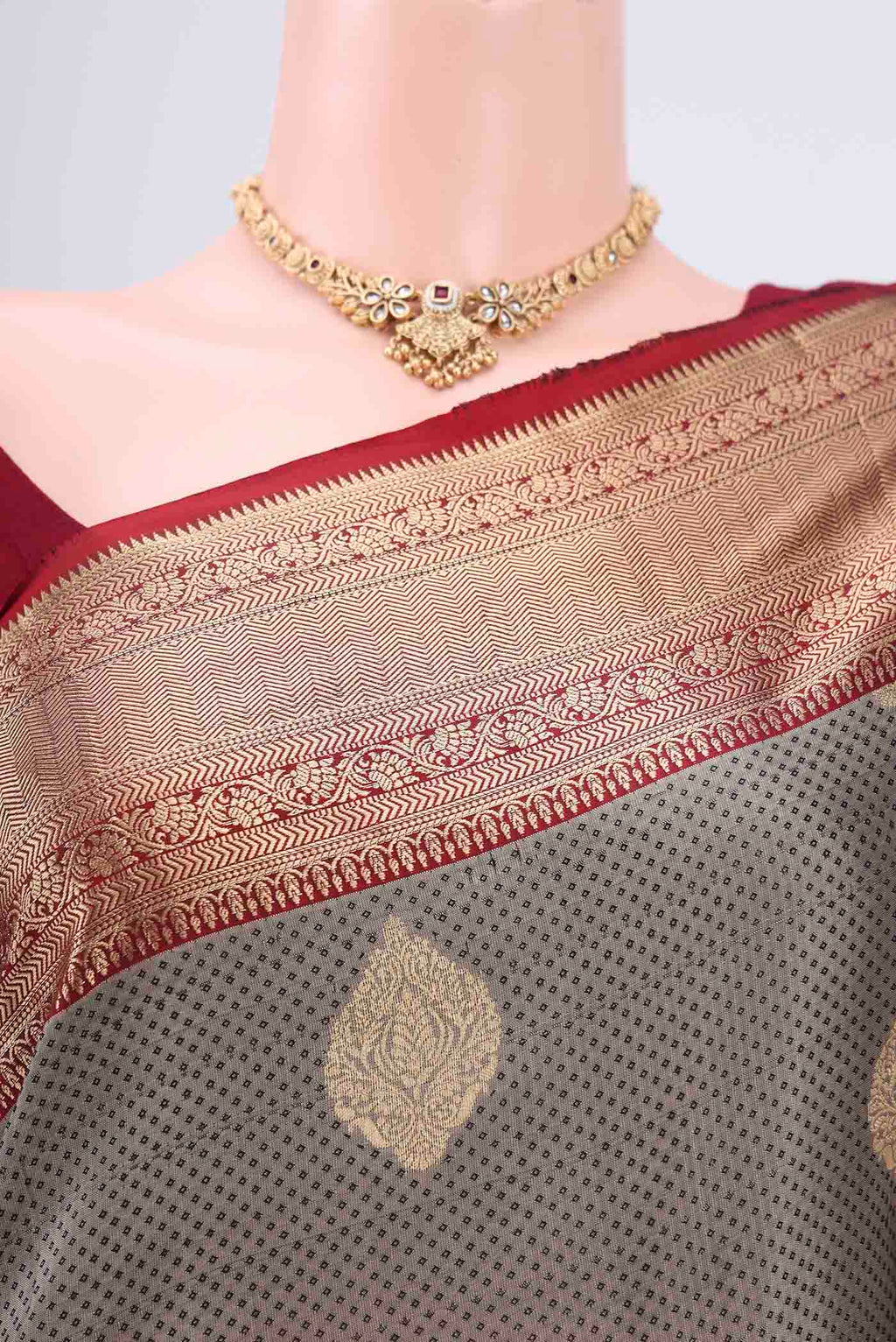 Border image of Grey Soft Silk Saree with Zari Butta on the body and Zari Border. 