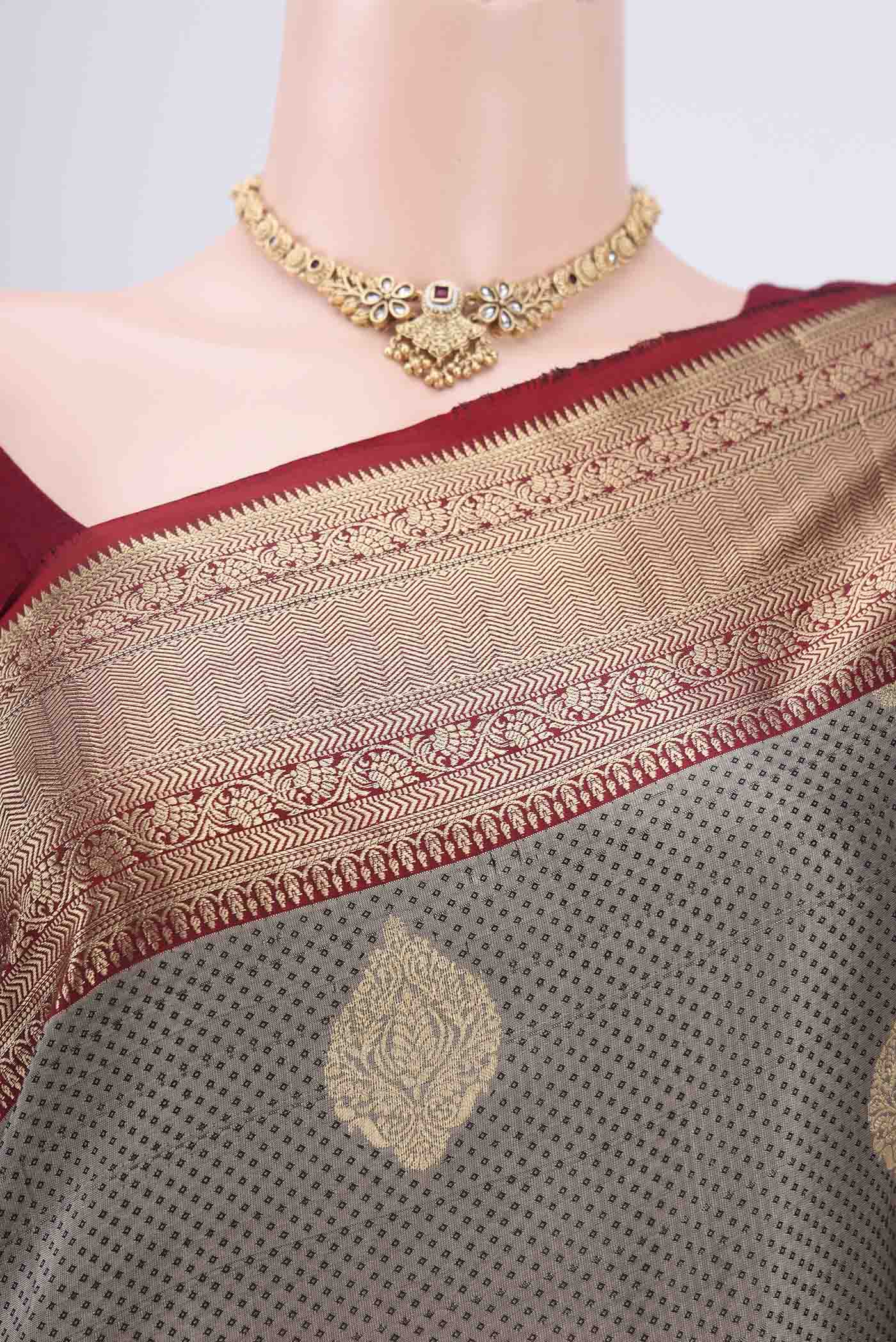 Border image of Grey Soft Silk Saree with Zari Butta on the body and Zari Border. 