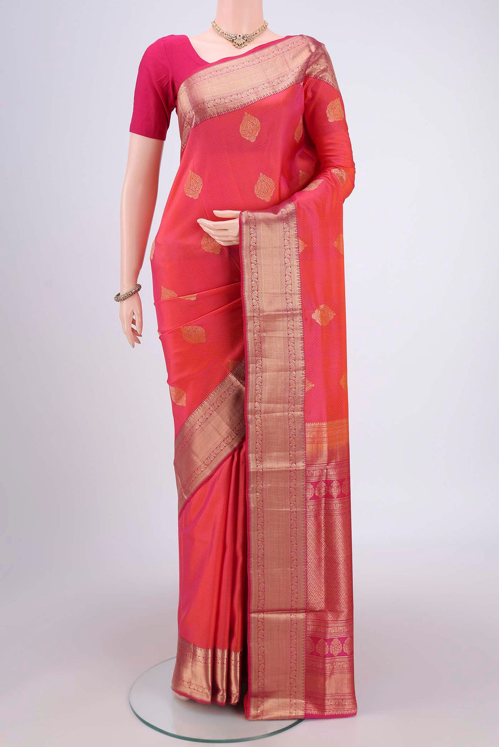 Pink Soft Silk Saree with Zari Butta on the body and Zari Border.  displayed on a mannequin