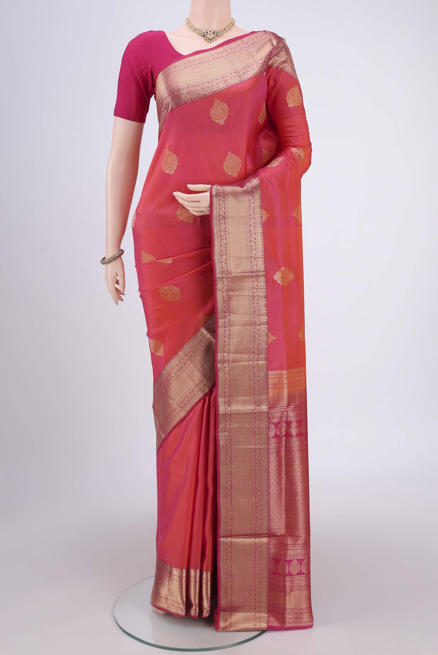 Pink Soft Silk Saree with Zari Butta on the body and Zari Border.  displayed on a mannequin