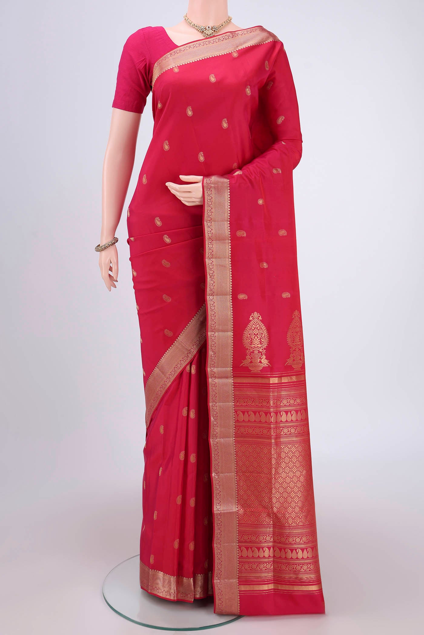 Pink Soft Silk Saree with Zari Butta on the body and Zari Border.  displayed on a mannequin