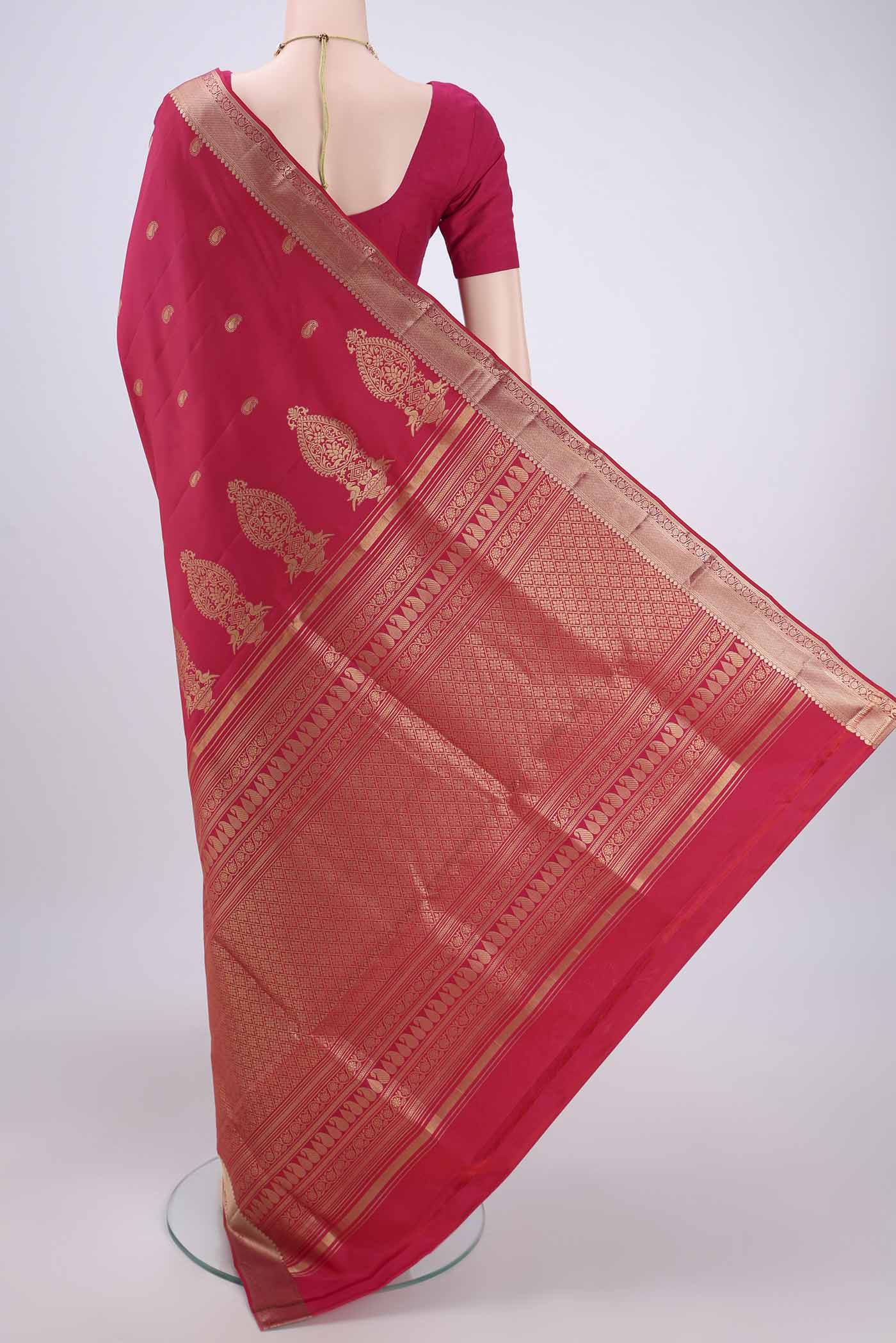 Flat view of Pink Soft Silk Saree with Zari Butta on the body and Zari Border. 