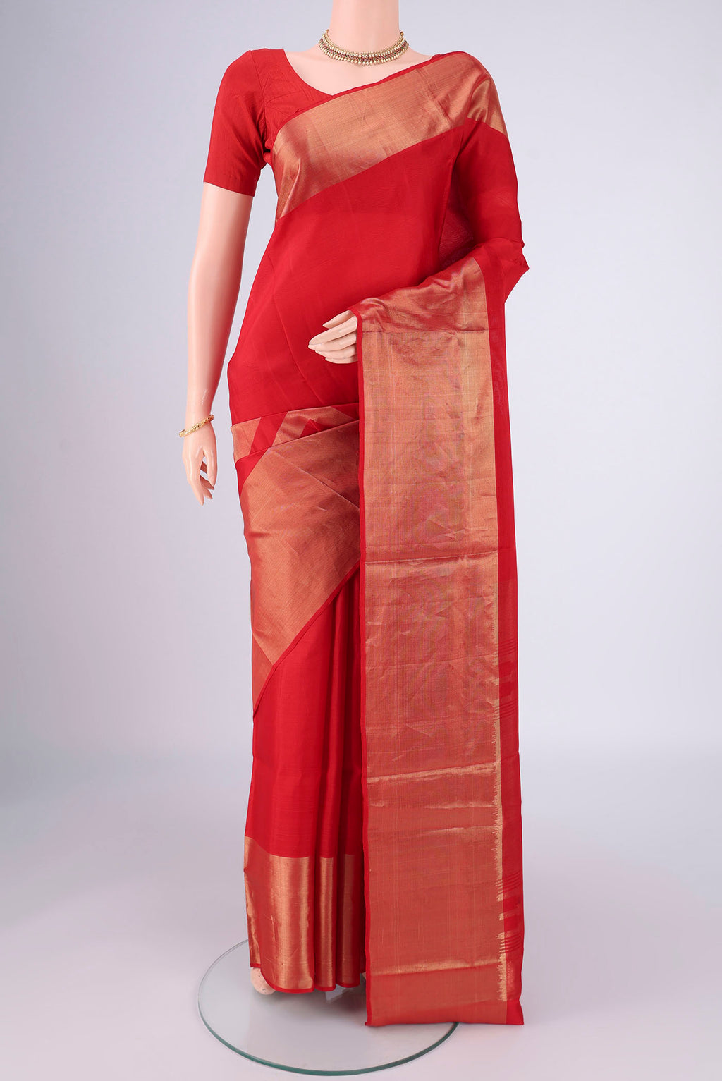 Red Soft Silk Saree with Zari Butta on the body and Zari Border.  displayed on a mannequin