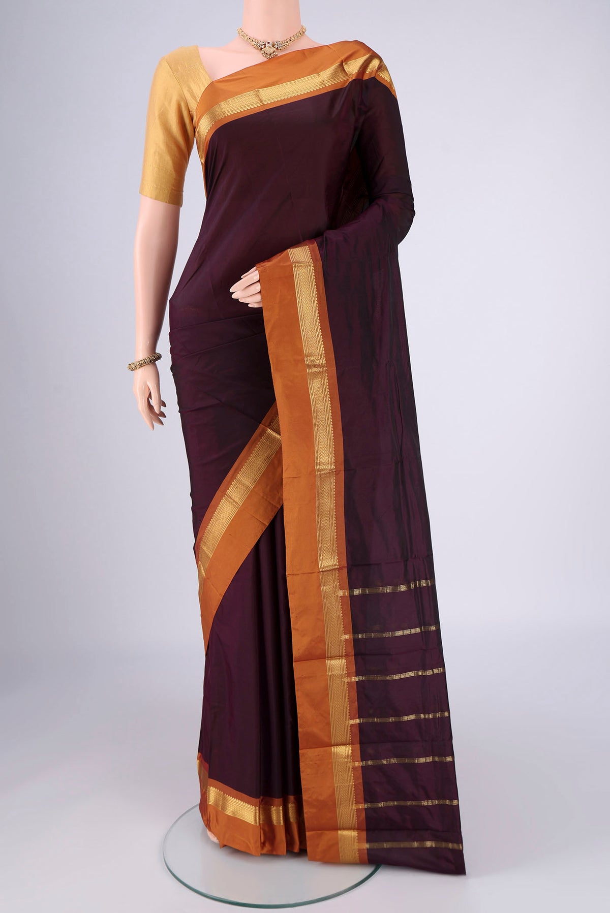 Coffee Brown Blended Bangalore Silk Saree with Plain Body and Zari Border.  displayed on a mannequin