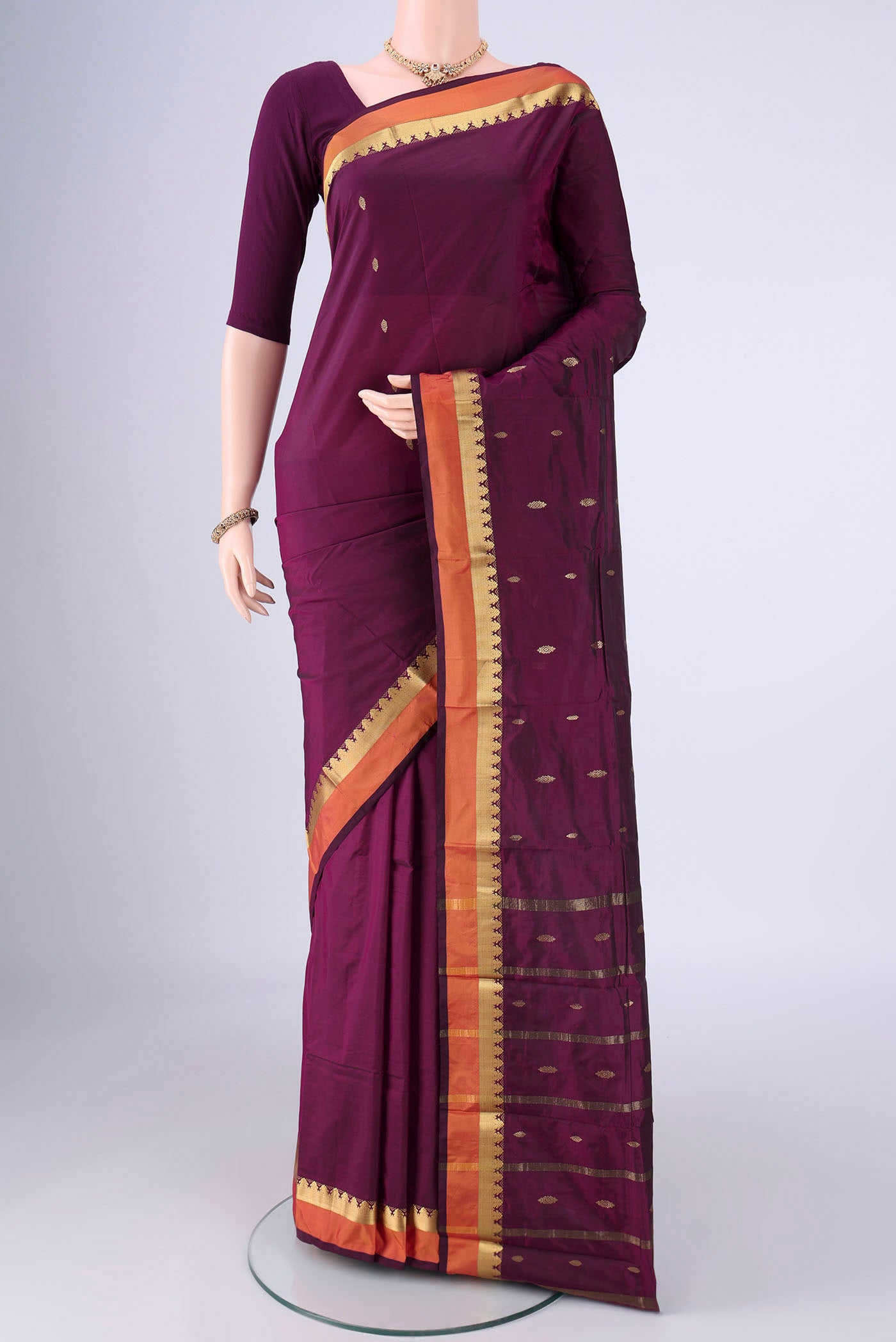Purple Blended Bangalore Silk Saree with Zari Butta on the body and Zari Border.  displayed on a mannequin