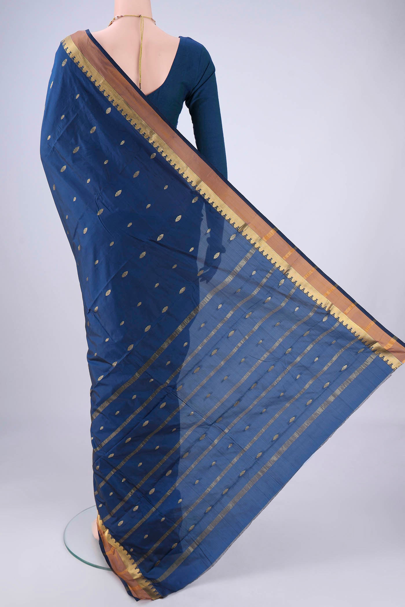 Flat view of Dark Blue Blended Bangalore Silk Saree with Zari Butta on the body and Zari Border. 