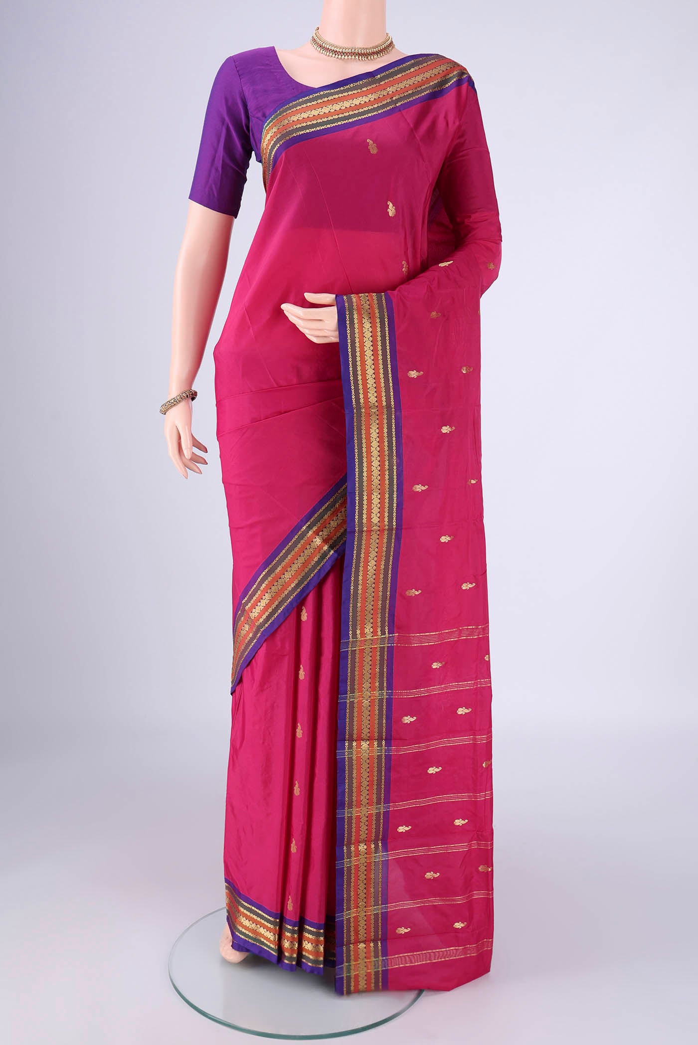 Rani Pink Blended Bangalore Silk Saree with Zari Butta on the body and Zari Border.  displayed on a mannequin