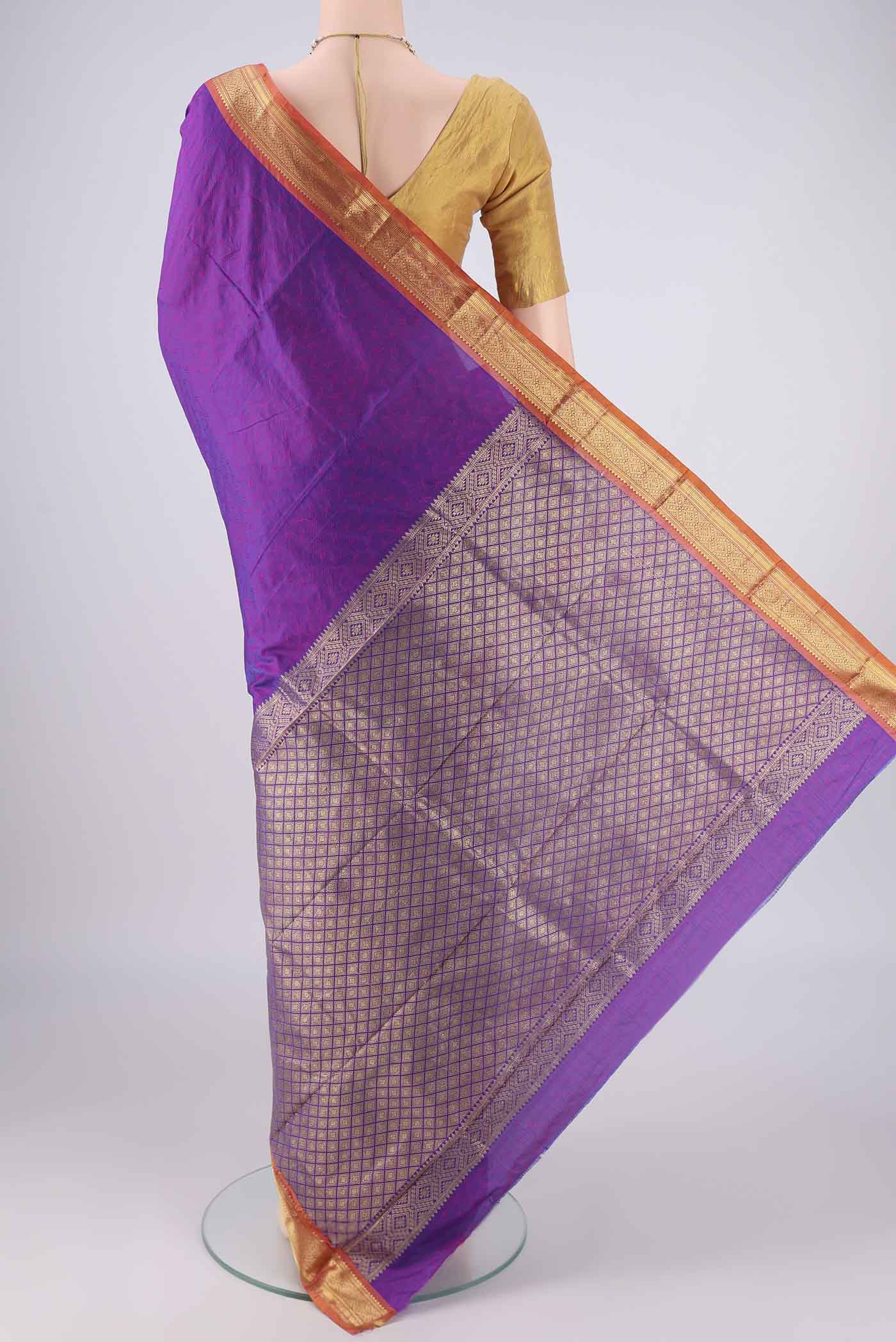 Flat view of Purple Blended Bangalore Silk Saree with Jacquard design on the body and Zari Border. 